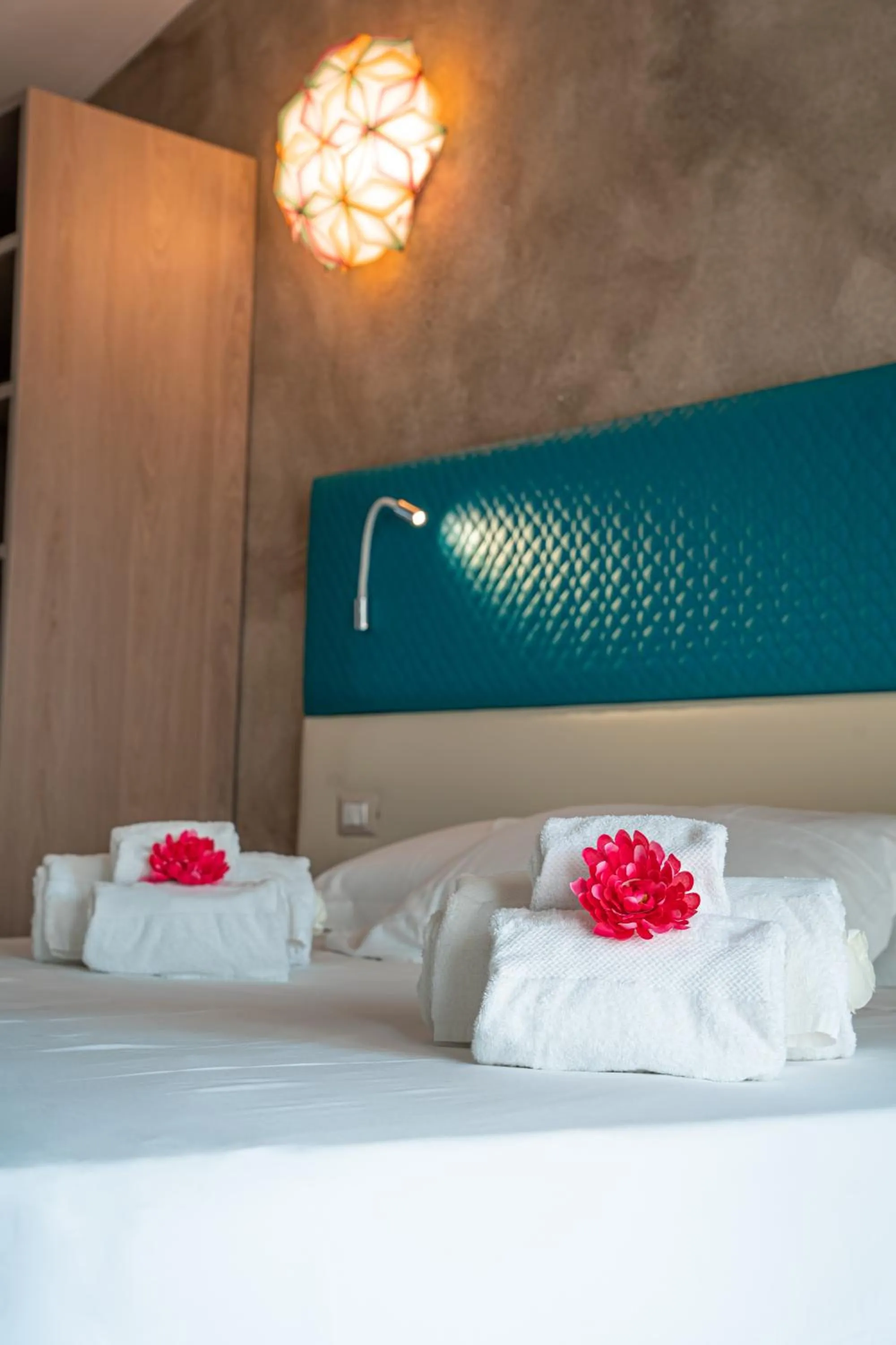 Bed in AQUA SARDINIA boutique hotel
