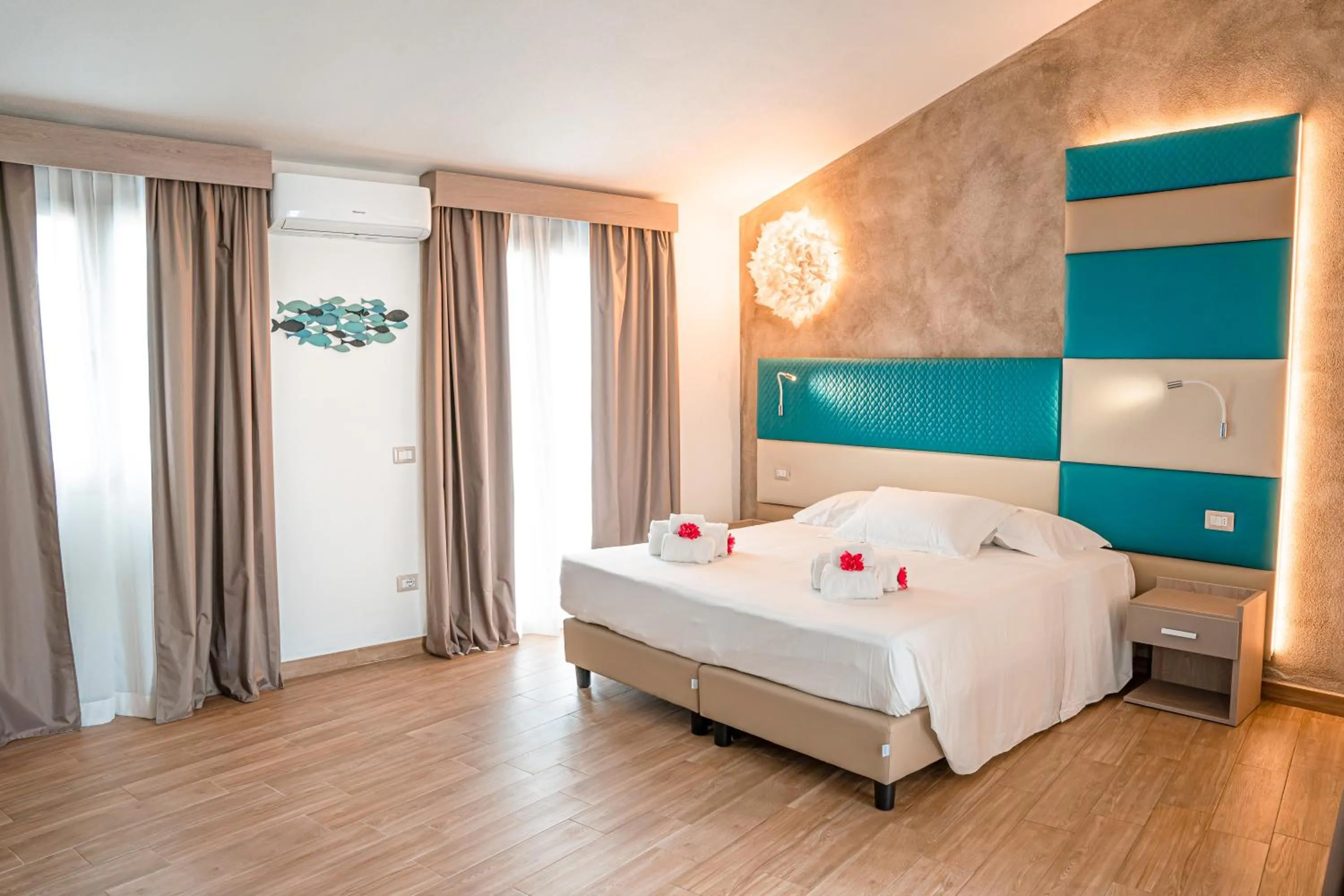 Bed in AQUA SARDINIA boutique hotel