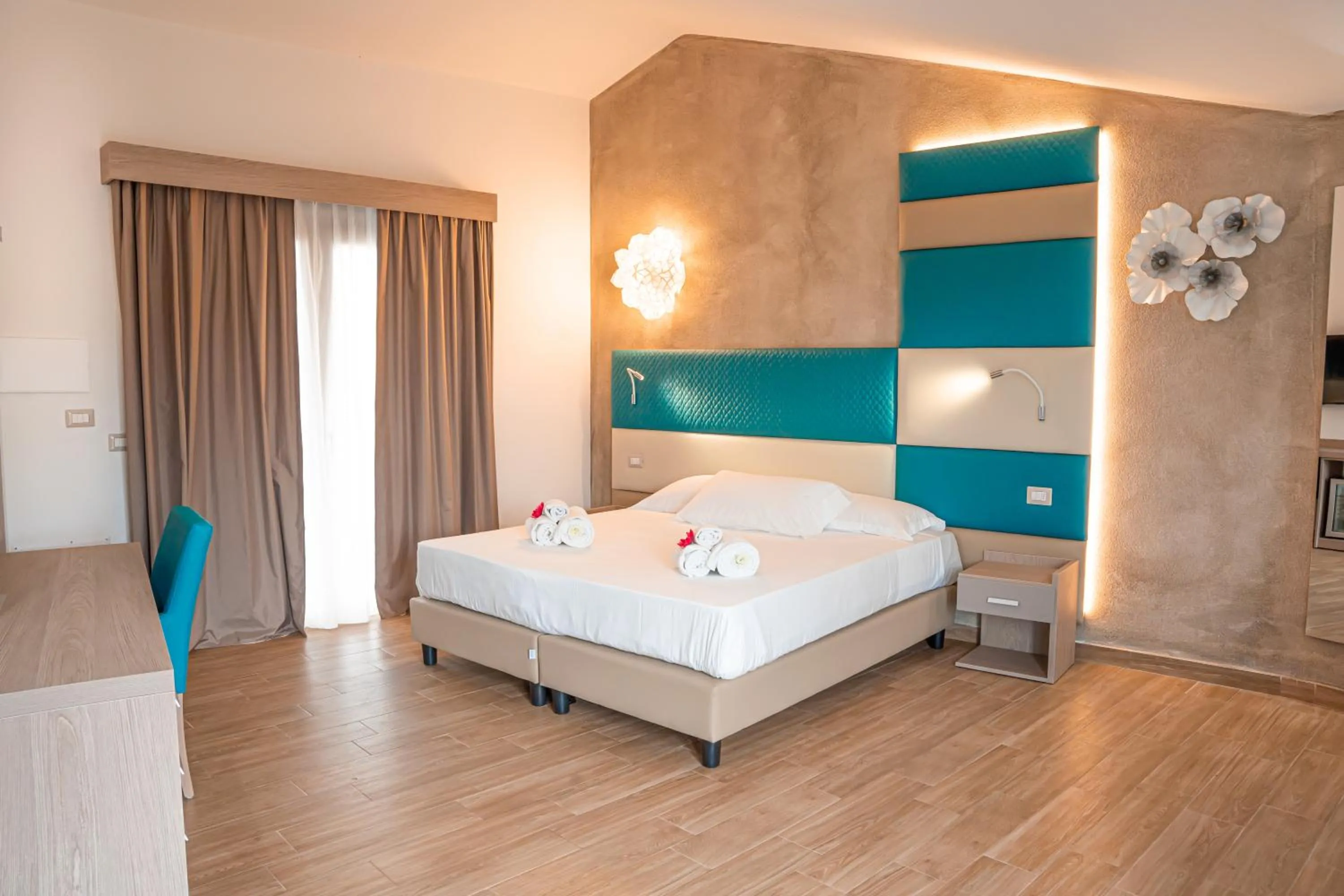 Bed in AQUA SARDINIA boutique hotel