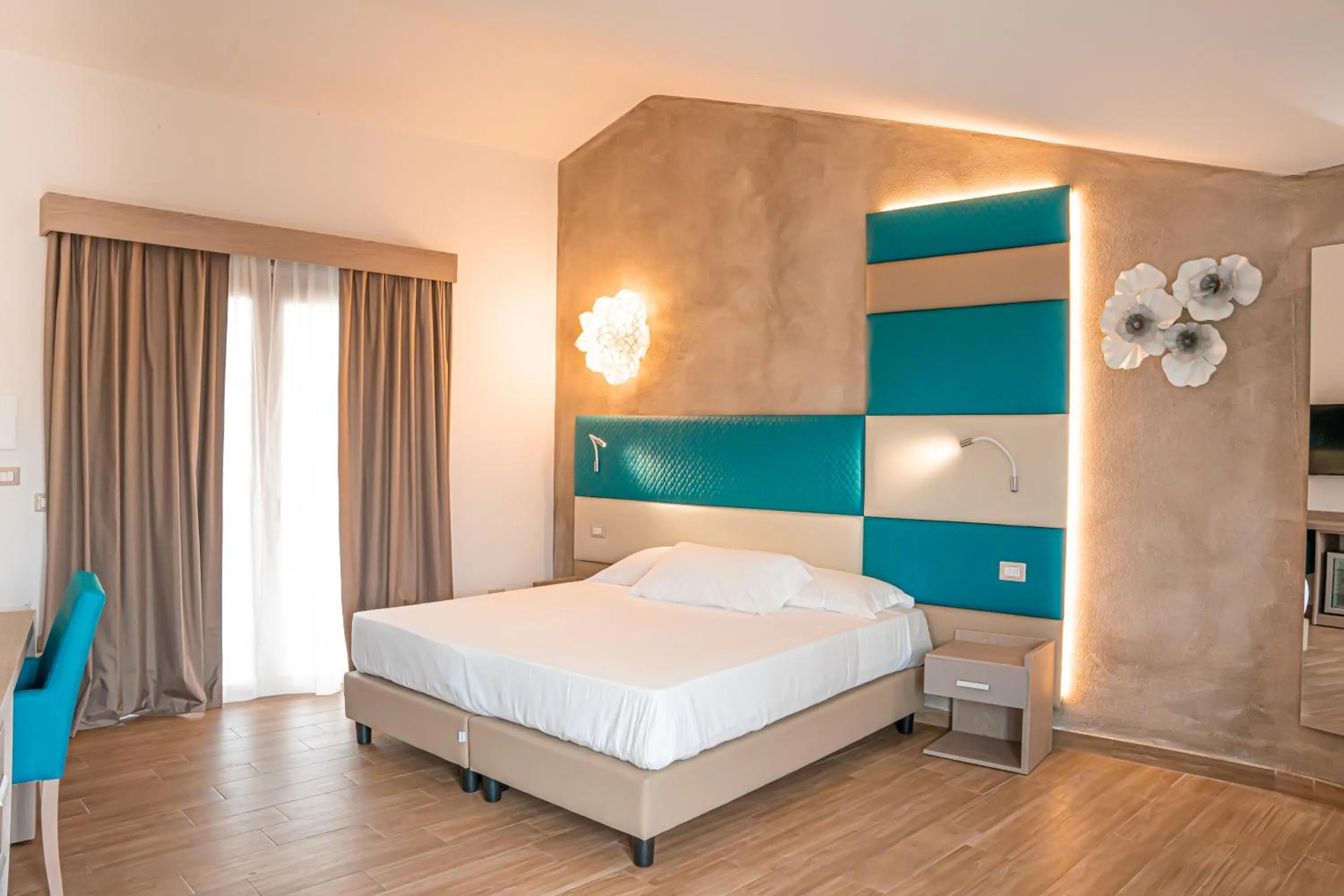 Bed in AQUA SARDINIA boutique hotel