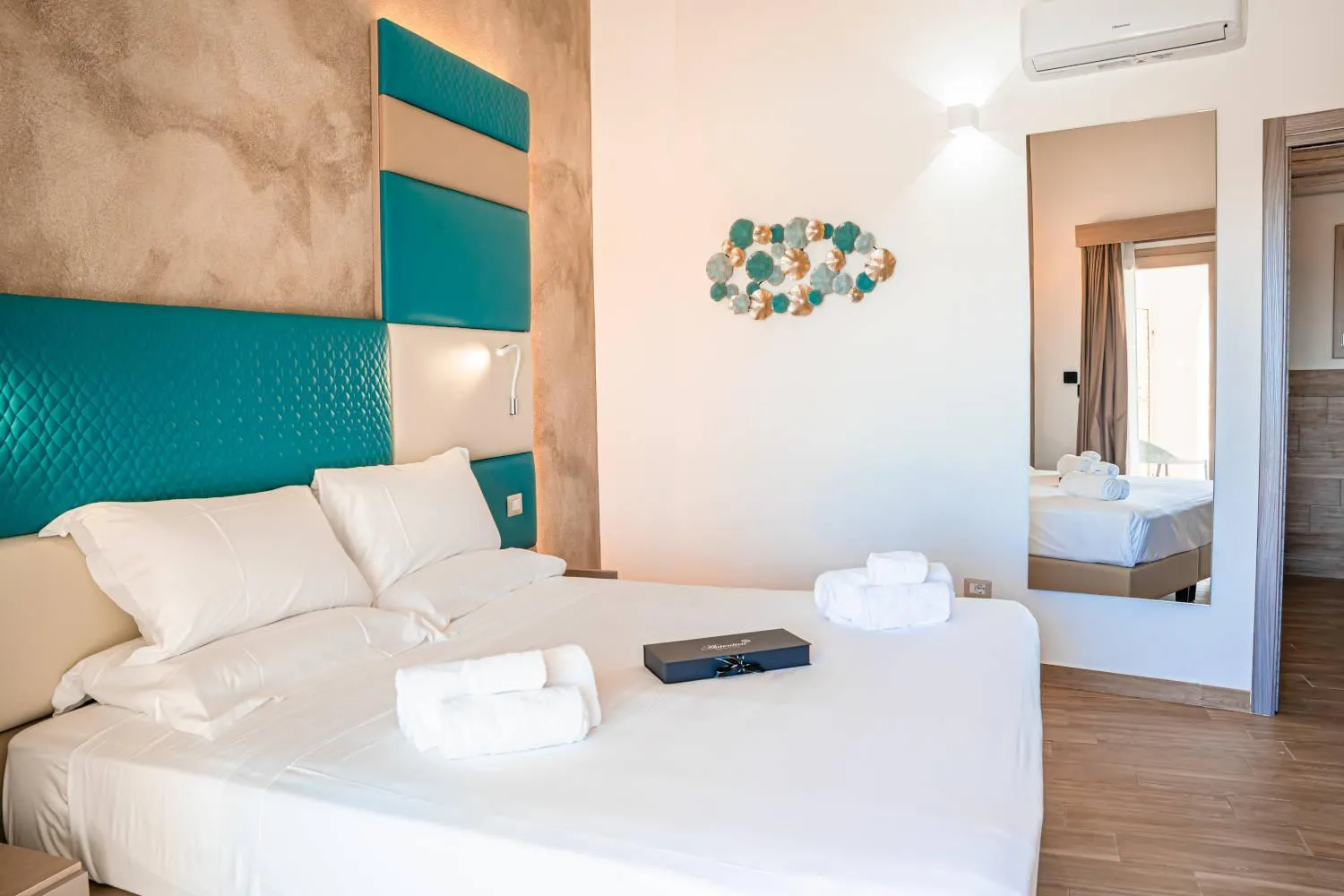Bed in AQUA SARDINIA boutique hotel