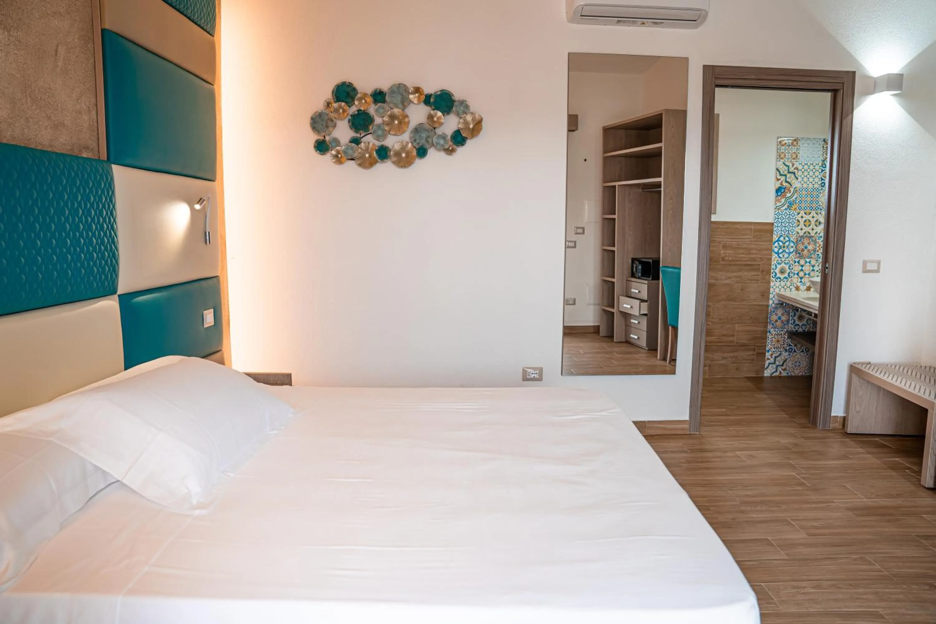 Bed in AQUA SARDINIA boutique hotel