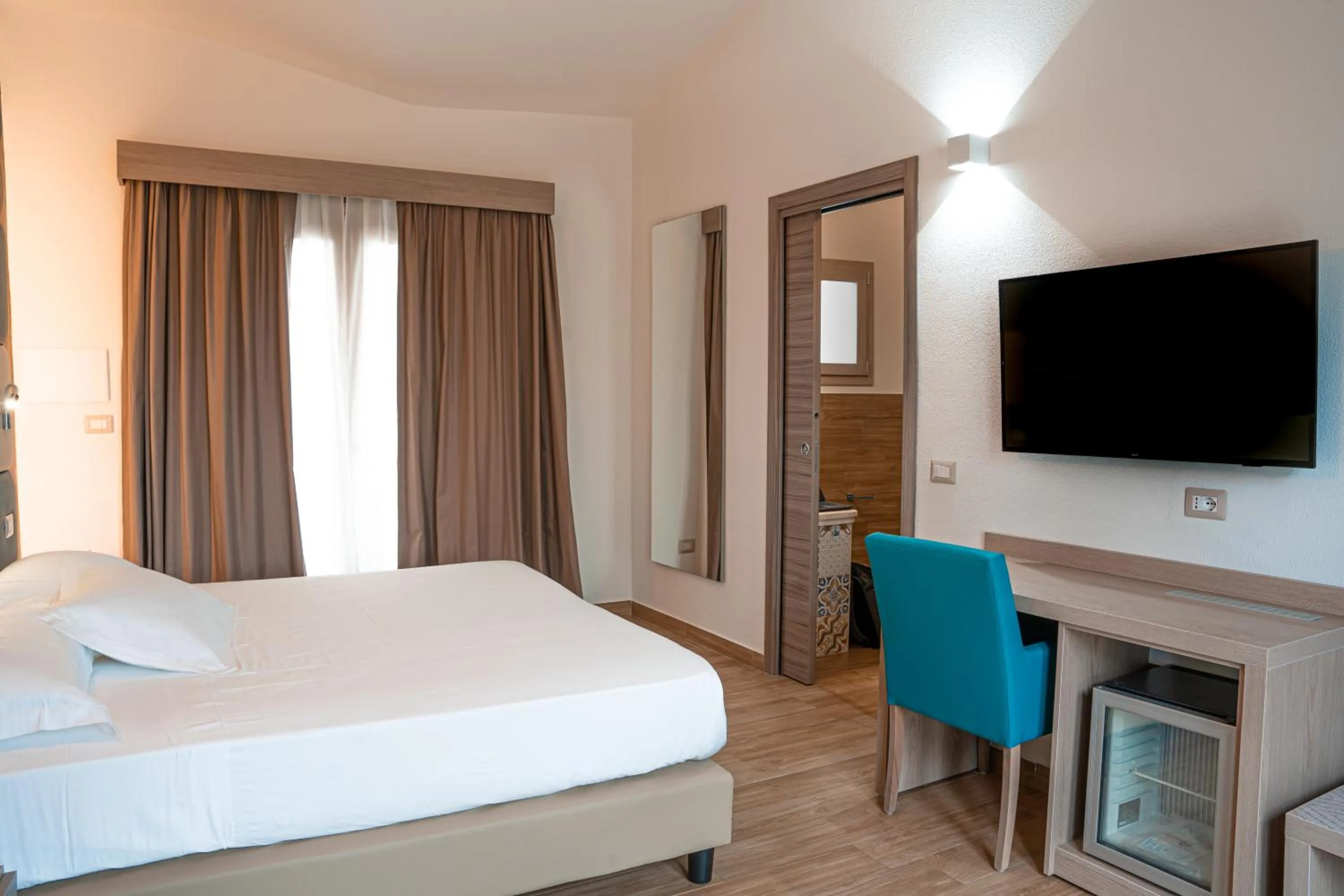 Bed in AQUA SARDINIA boutique hotel