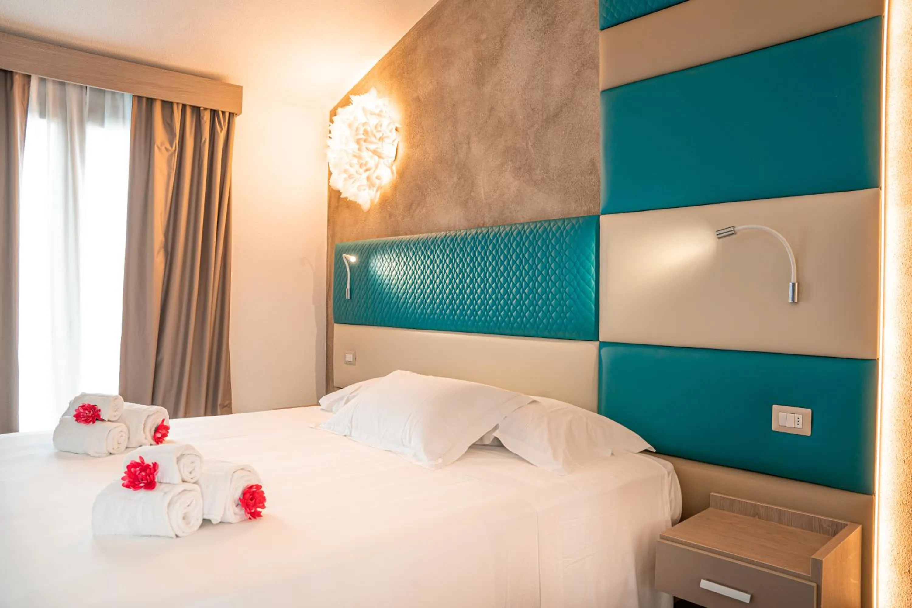 Bed in AQUA SARDINIA boutique hotel