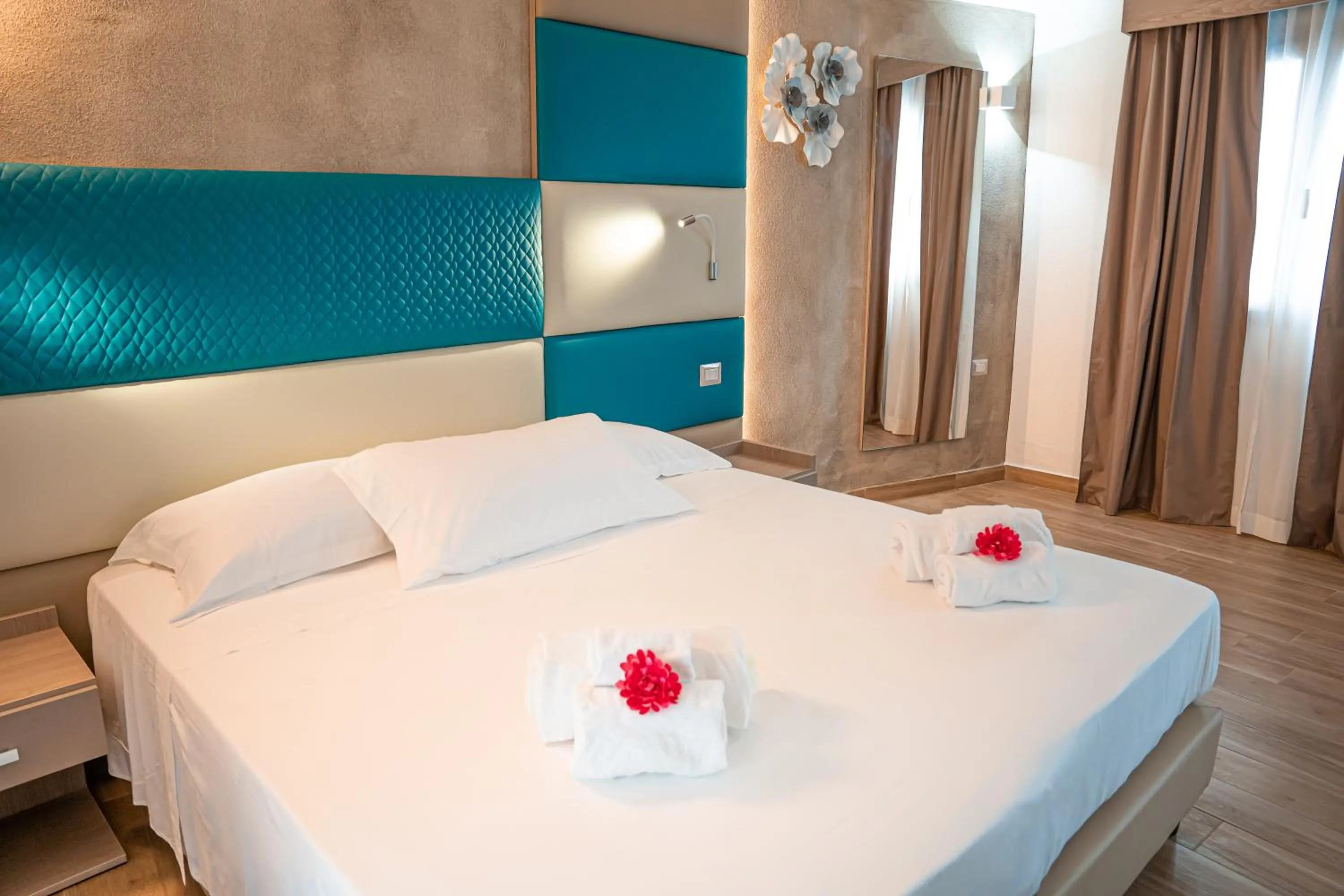 Bed in AQUA SARDINIA boutique hotel