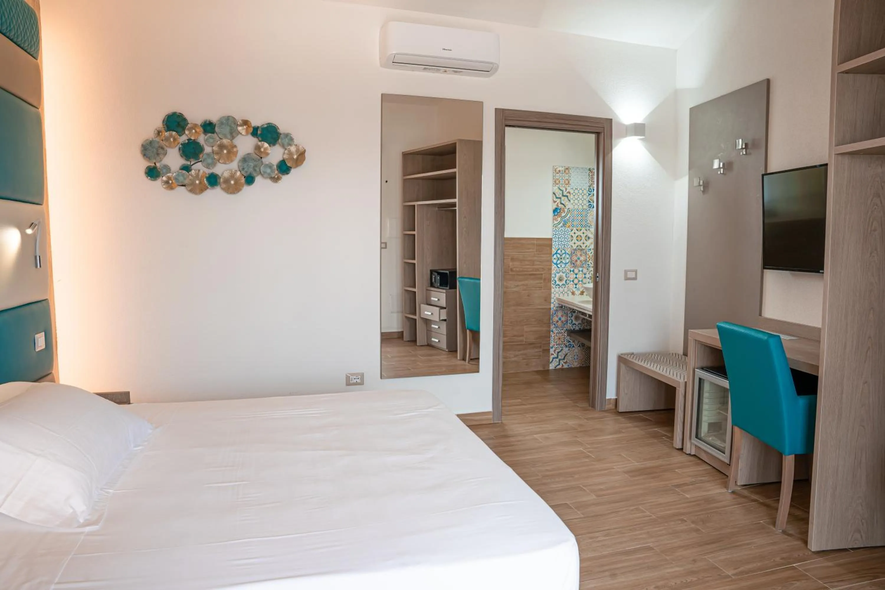 Bed in AQUA SARDINIA boutique hotel