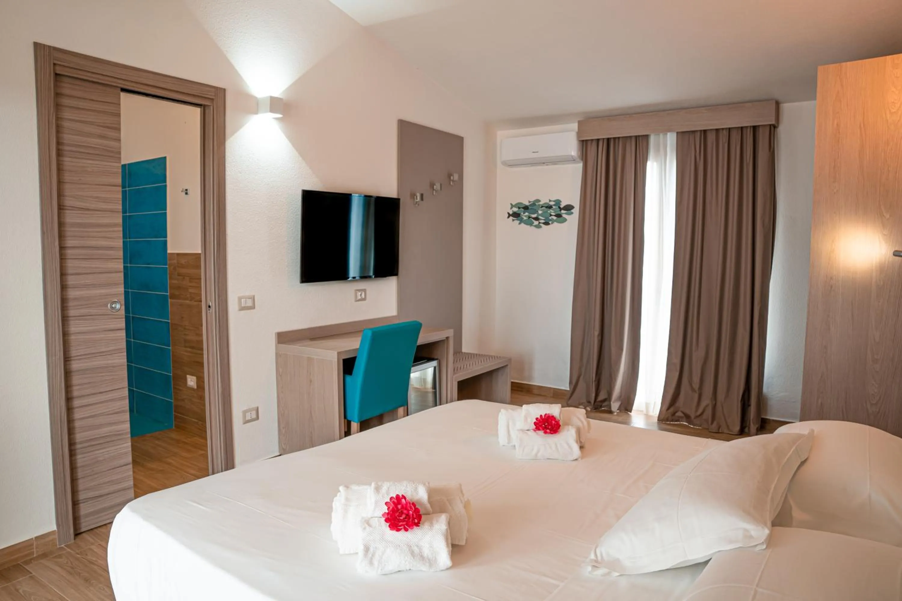 Bed in AQUA SARDINIA boutique hotel