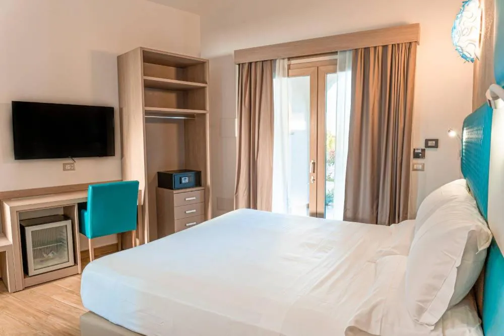 Bed in AQUA SARDINIA boutique hotel