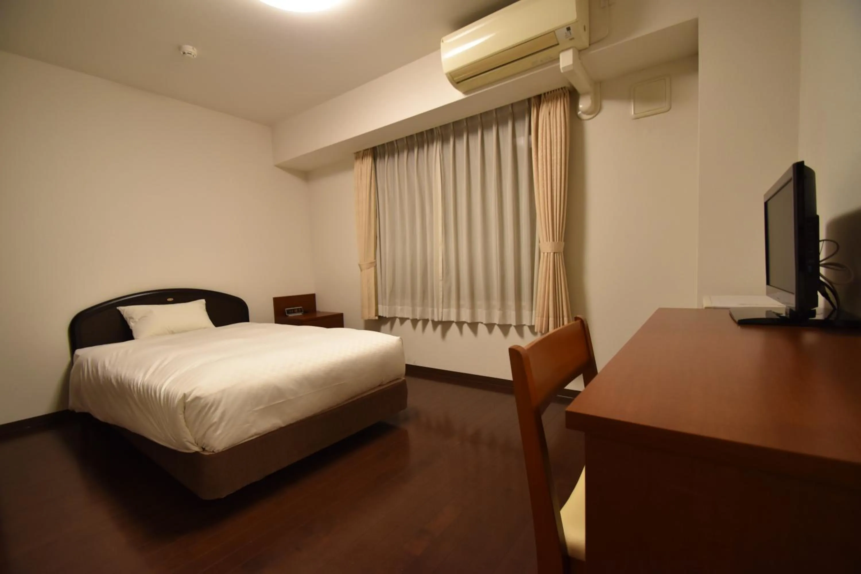 Bed in Hotel Hakata Place