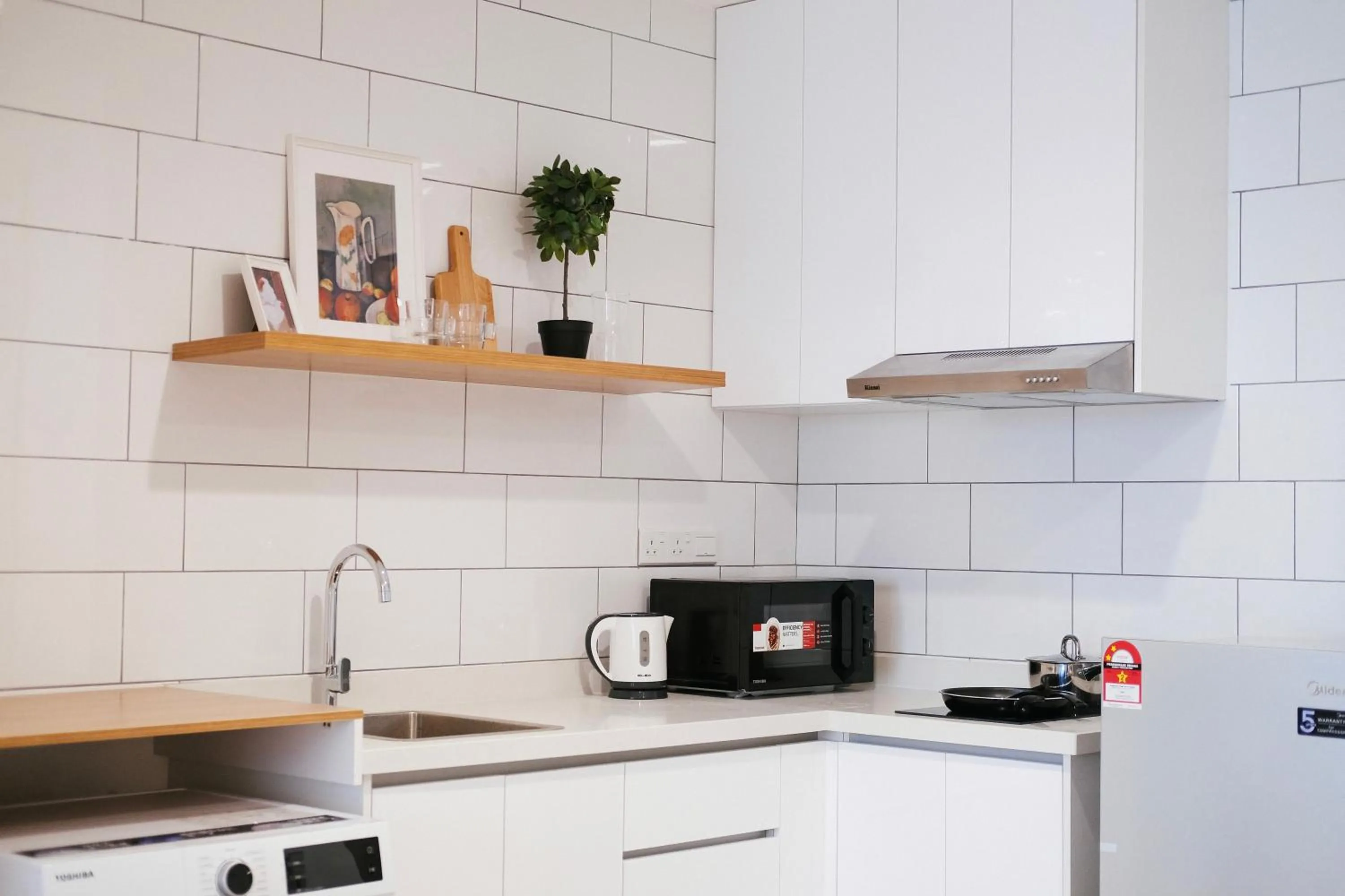 Kitchen or kitchenette in Arte Mont Kiara by CozyNest