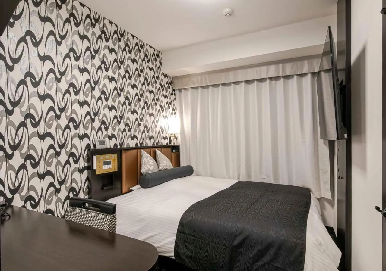 Photo of the whole room, Bed in APA Hotel Nagoya Ekimae