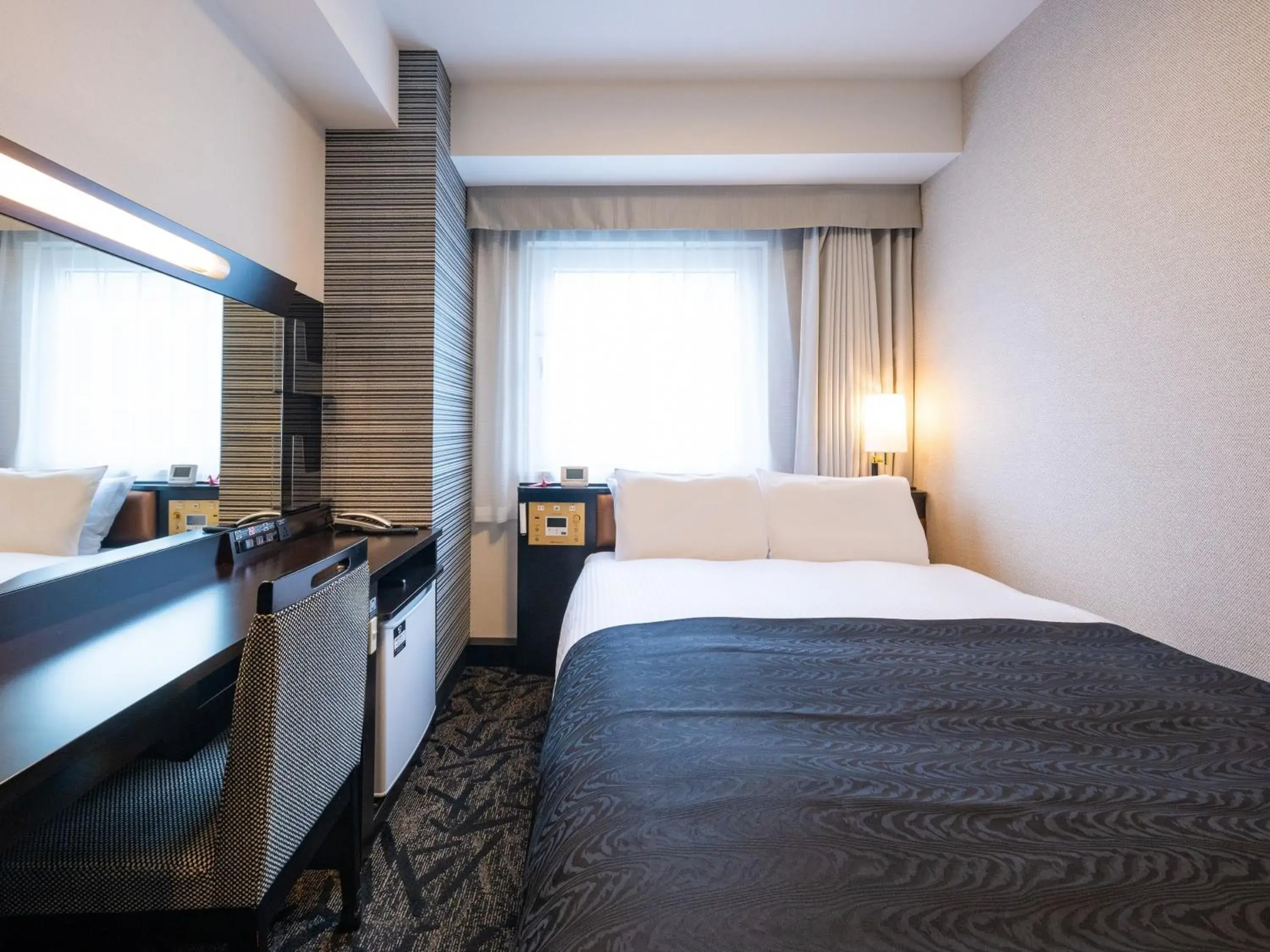 Photo of the whole room, Bed in APA Hotel Nagoya Ekimae Photo of the whole room, Bed in APA Hotel Nagoya Ekimae