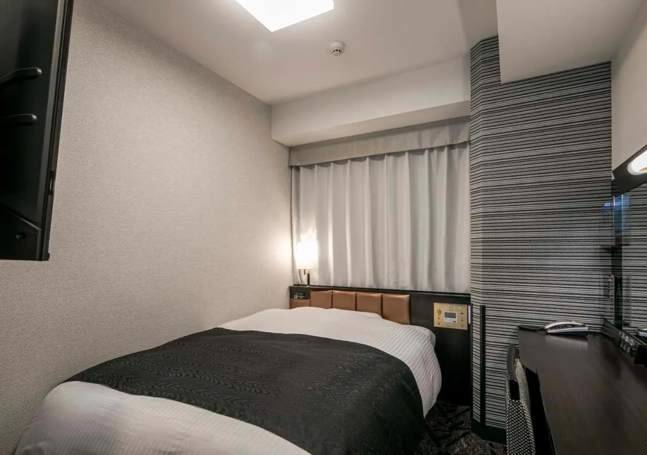 Photo of the whole room, Bed in APA Hotel Nagoya Ekimae