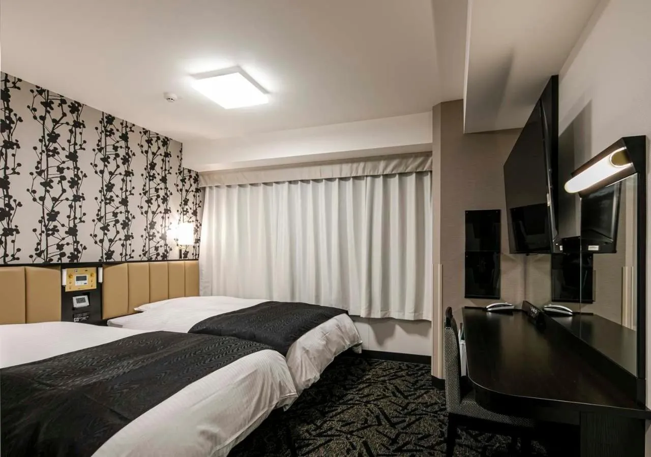 Photo of the whole room, Bed in APA Hotel Nagoya Ekimae