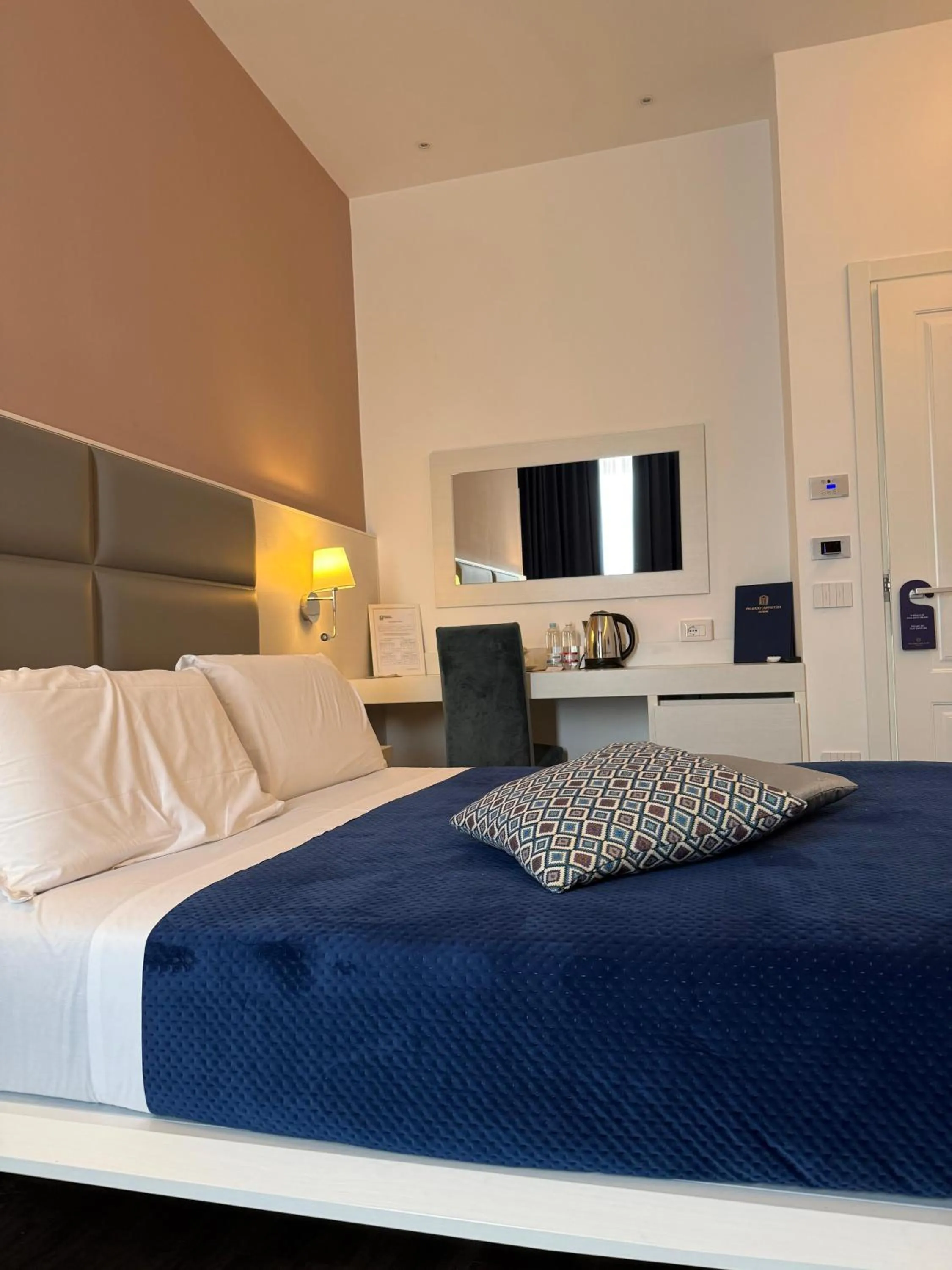 Bed in Palazzo Cappuccini Art Relais