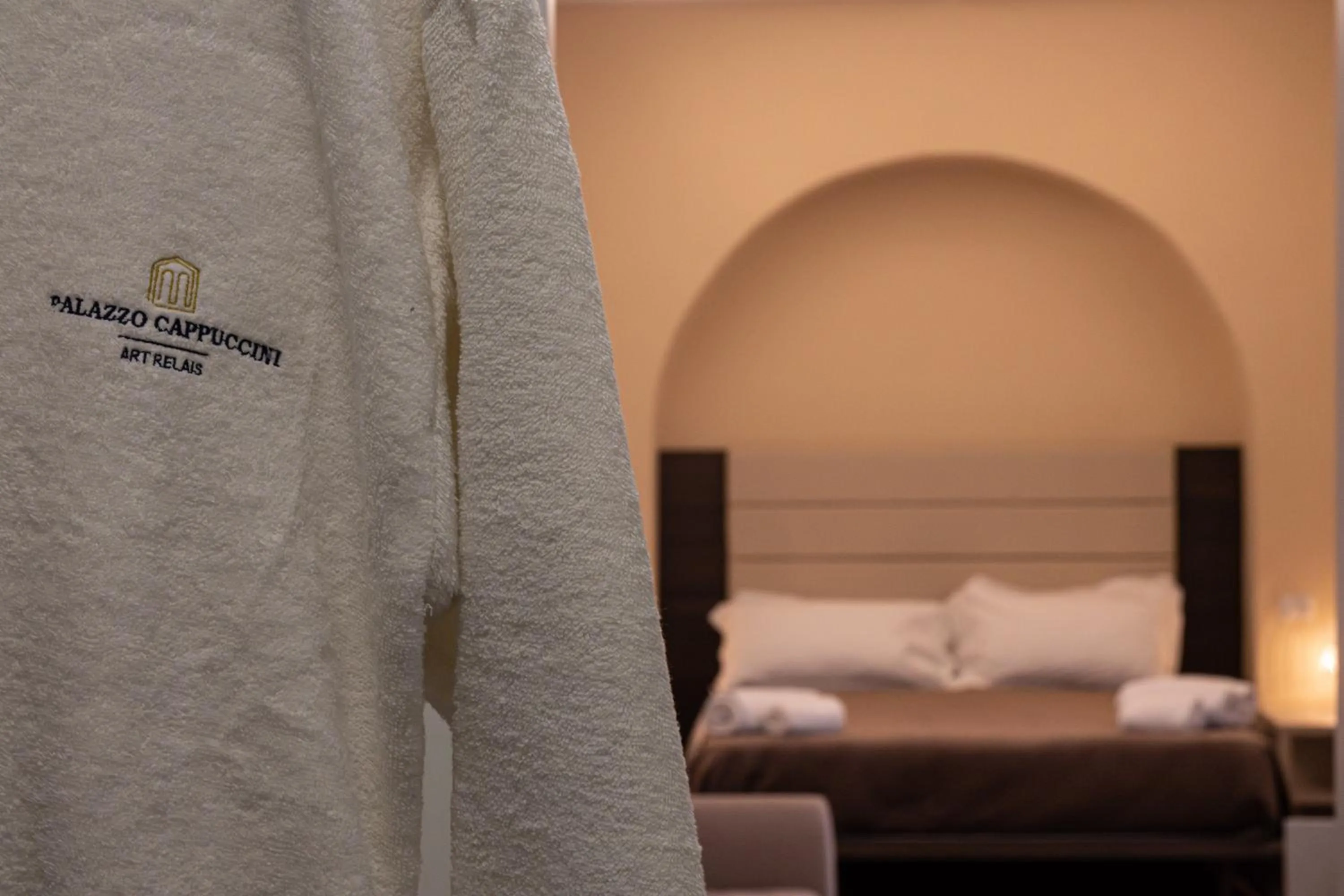 Bed in Palazzo Cappuccini Art Relais