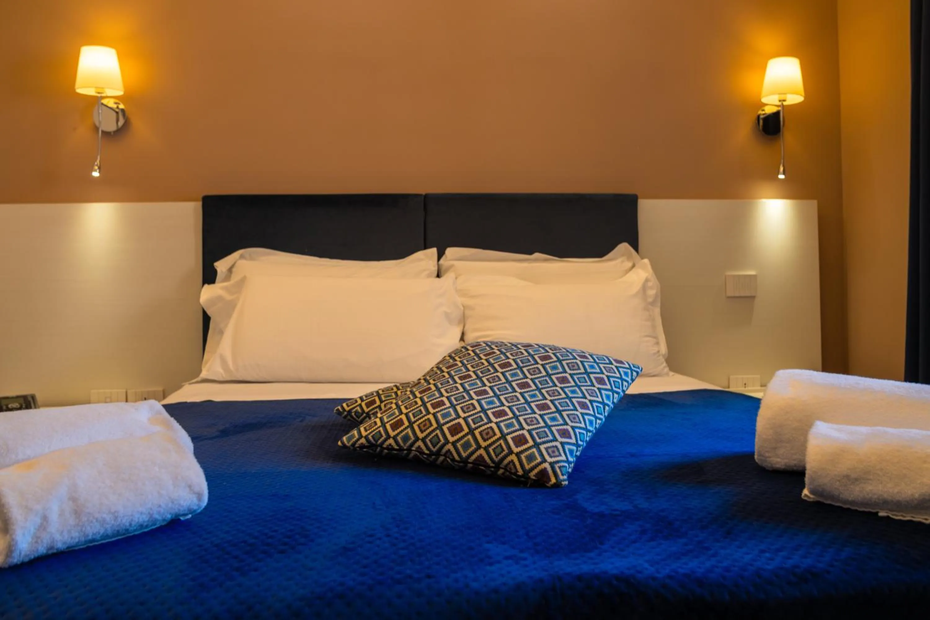 Bed in Palazzo Cappuccini Art Relais