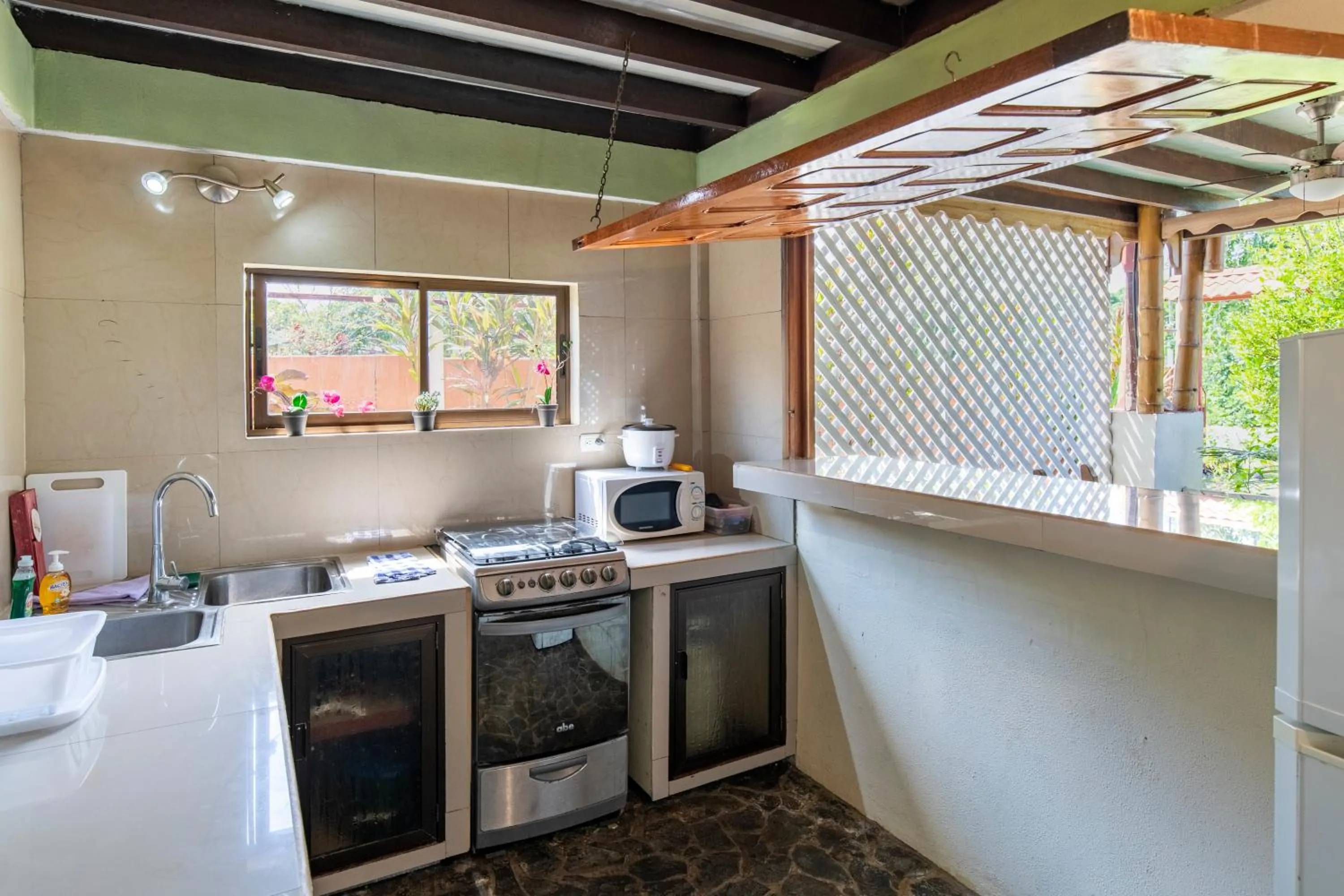 kitchen in Pangea Lodge with Shared Pool at the Heart of Manzanillo