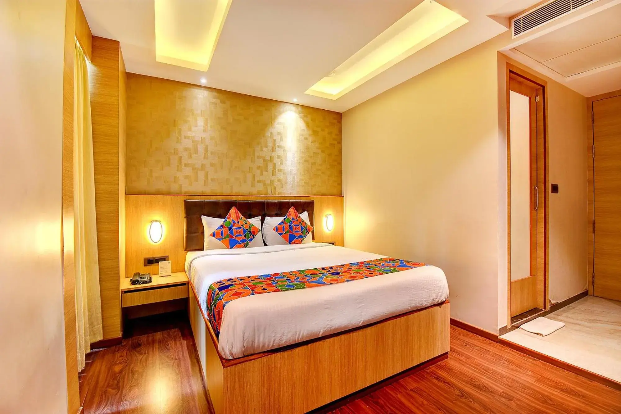 Seating area, Bed in FabHotel S Comfort Inn - Indiranagar Seating area, Bed in FabHotel S Comfort Inn - Indiranagar