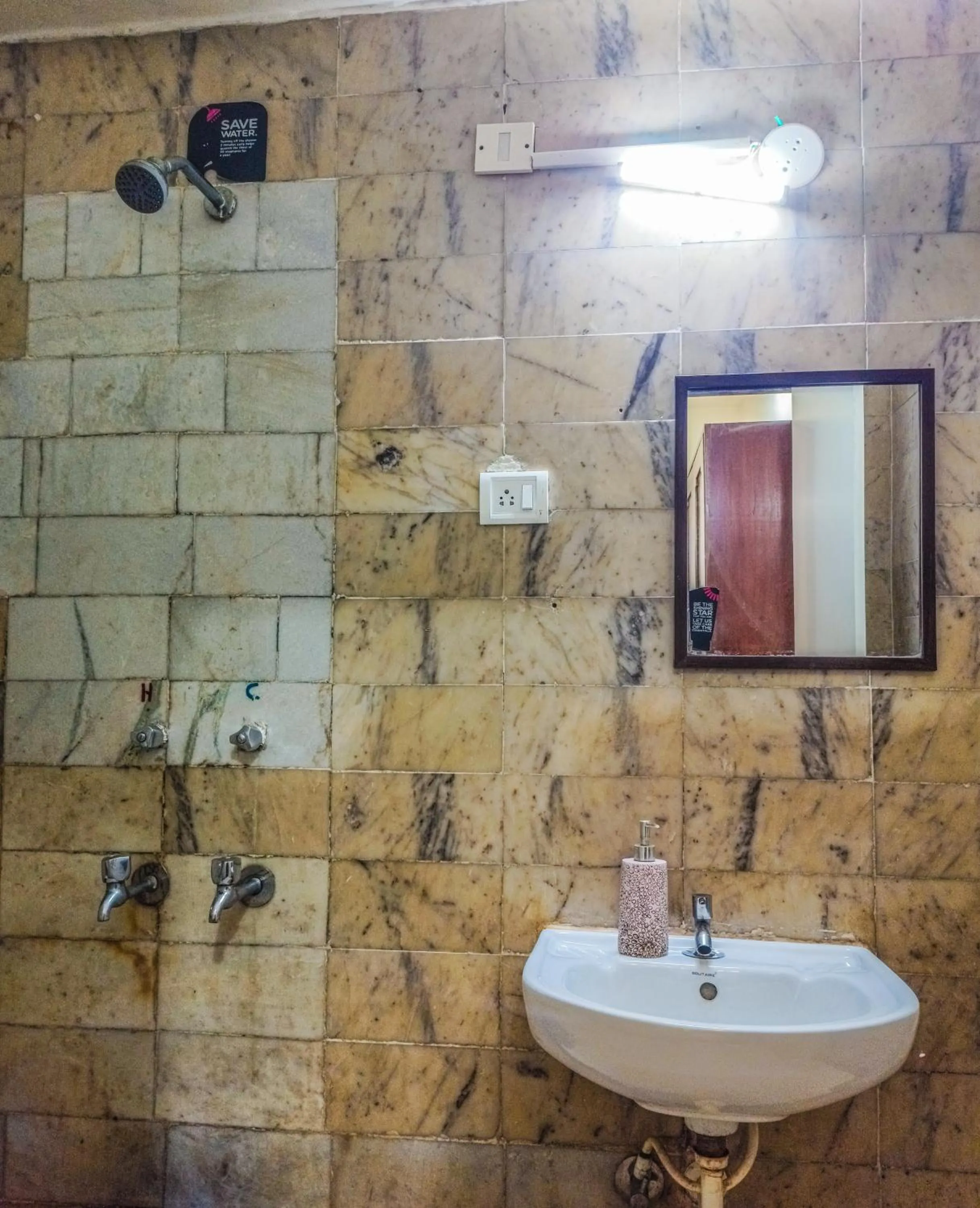 Bathroom in Olive Zip Calangute Mira by Embassy Group