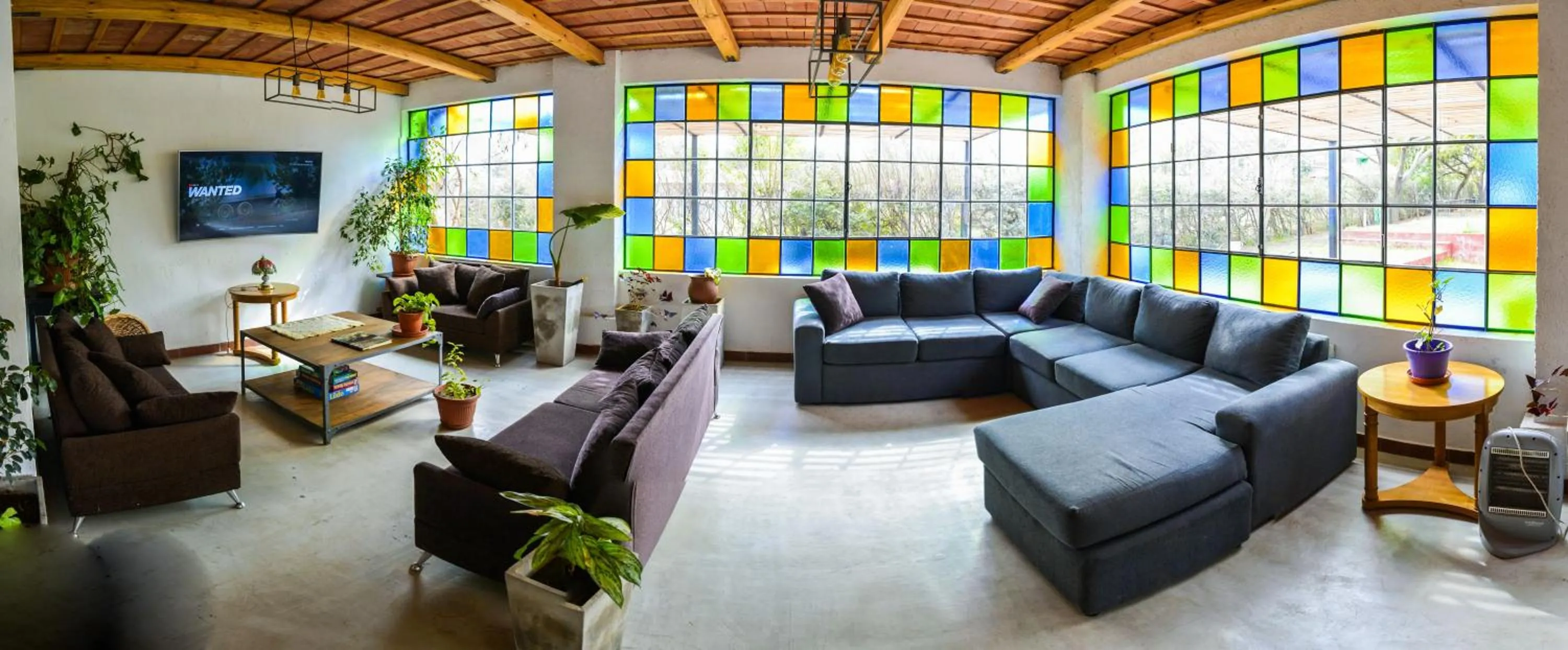 Communal lounge/ TV room in La Candida Hotel