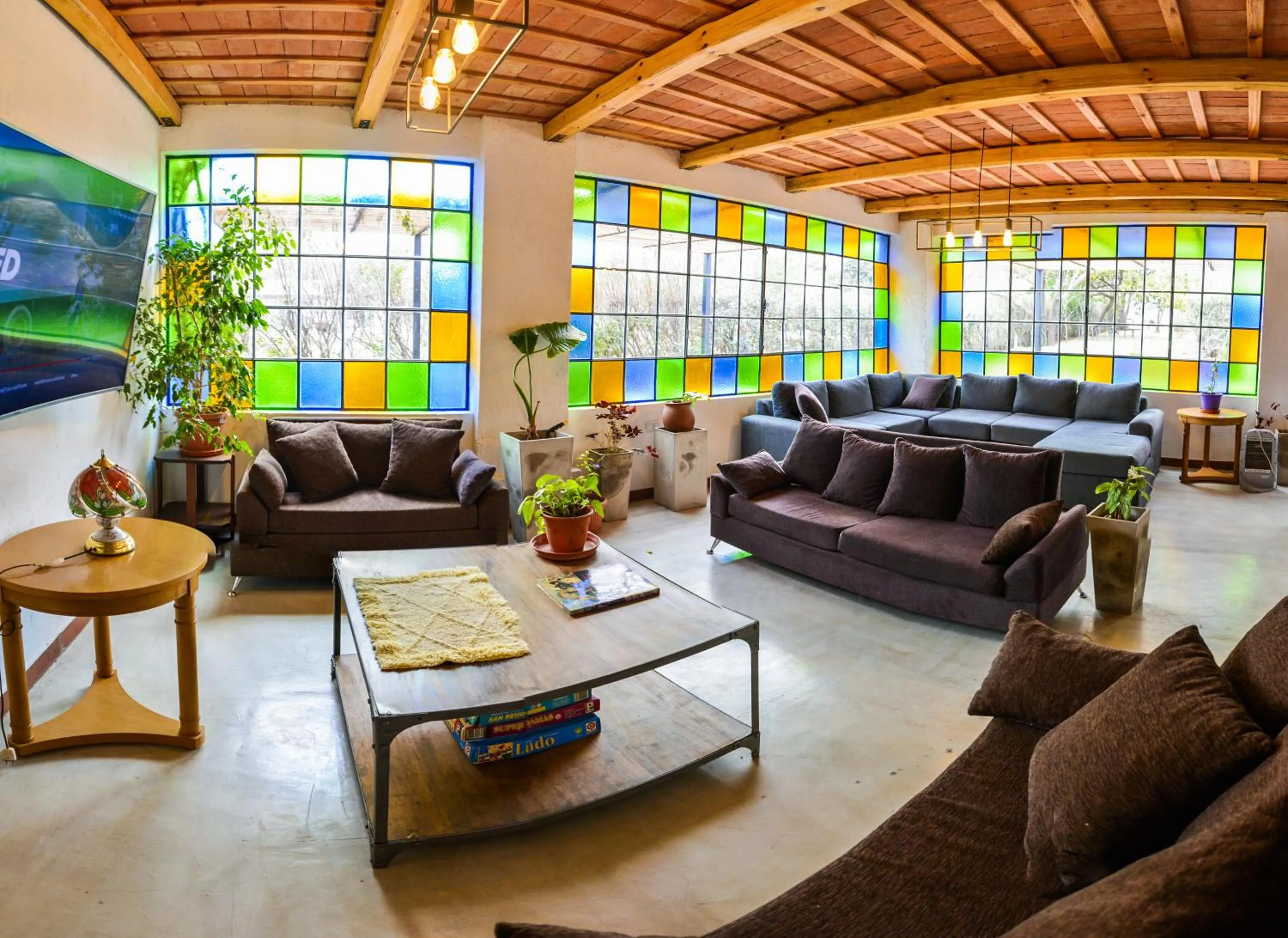 Communal lounge/ TV room in La Candida Hotel