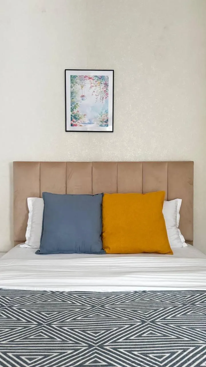 Bed in Seven City Apartments