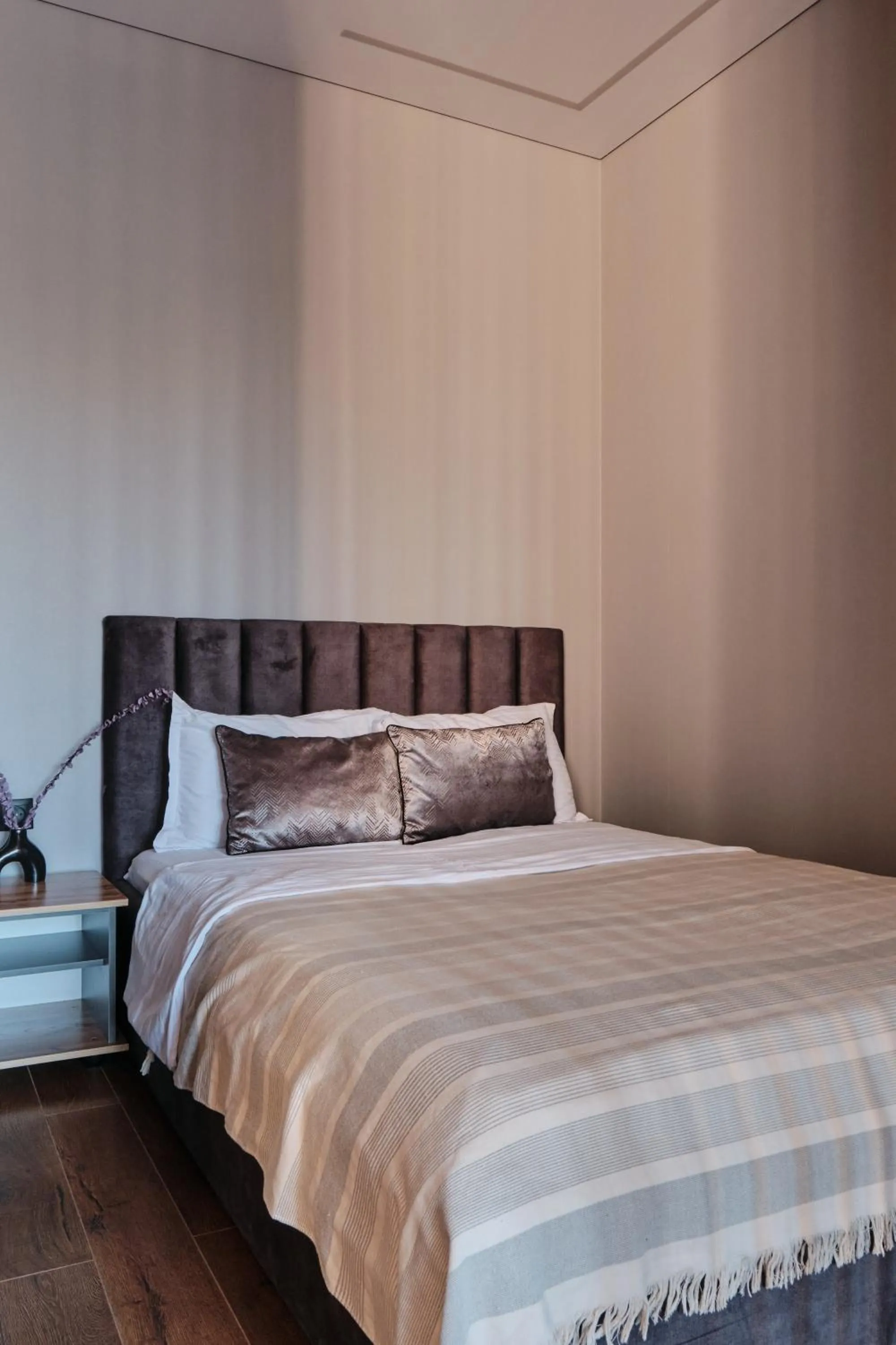 Bed in Seven City Apartments