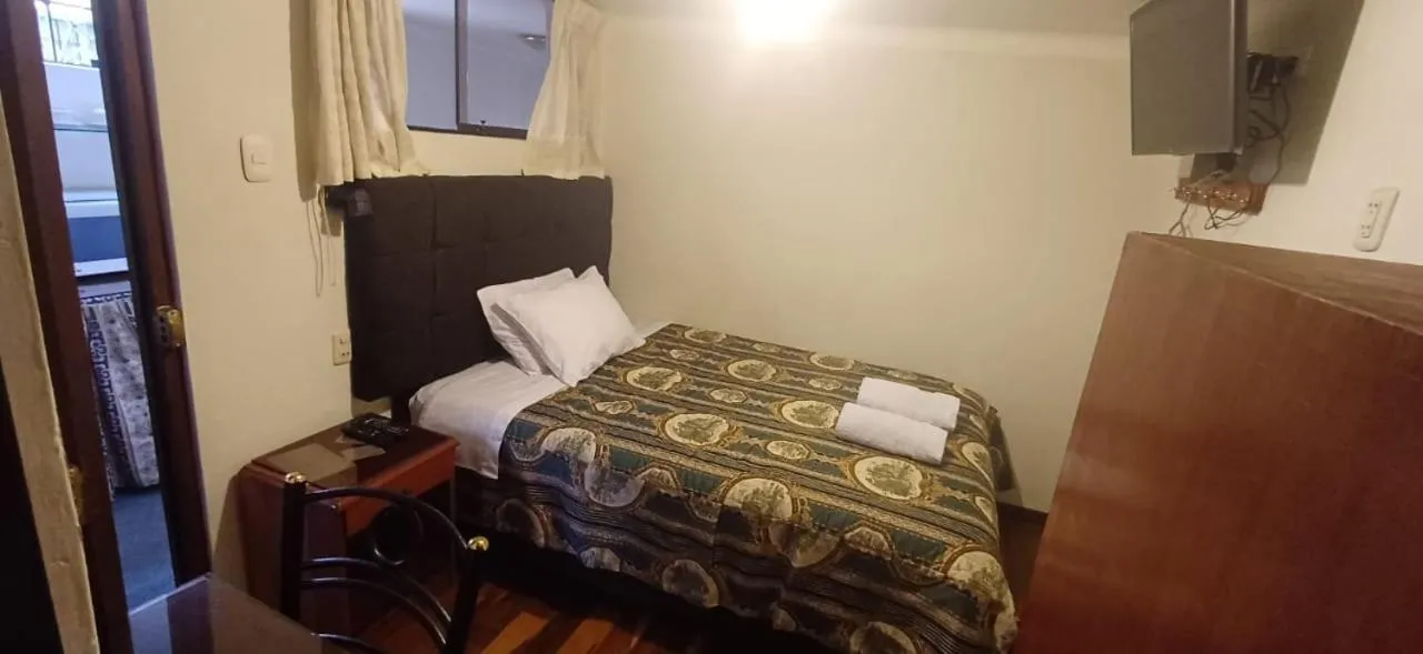 Bed in Hostal Alfredo's Palace