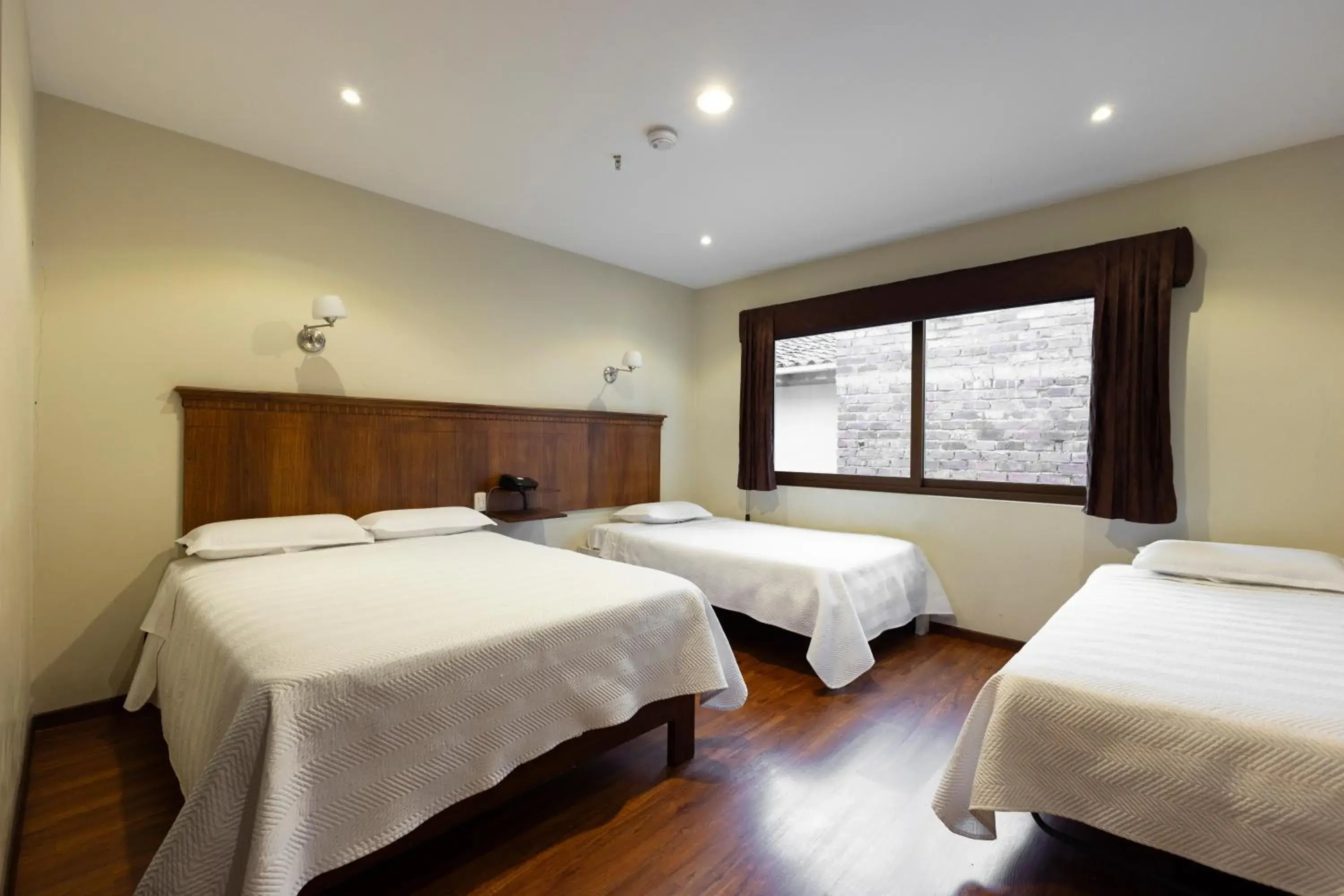 Bed in Hotel & Suites El Quijote Bed in Hotel & Suites El Quijote