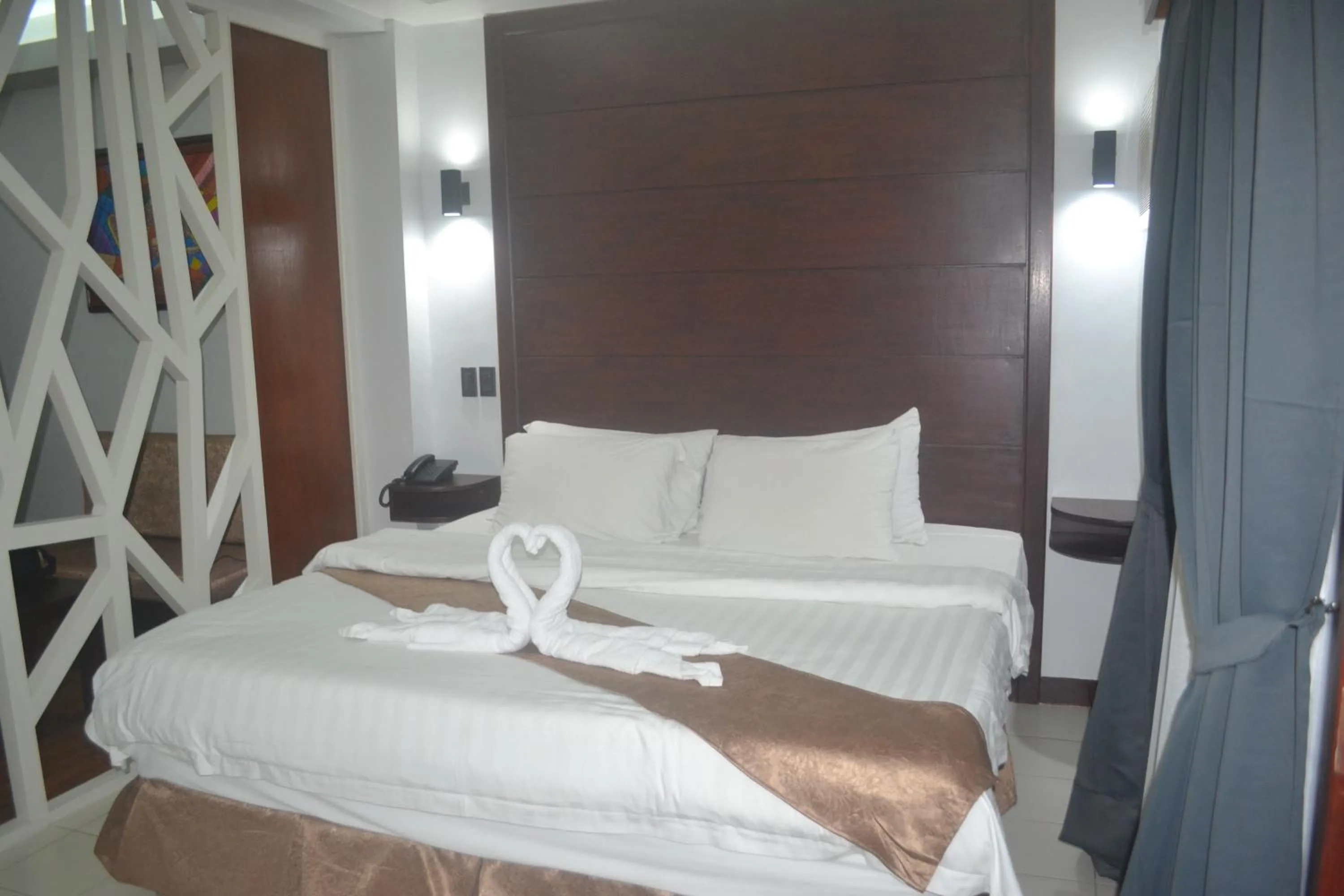 Bed in DM Residente Hotel Inns & Villas