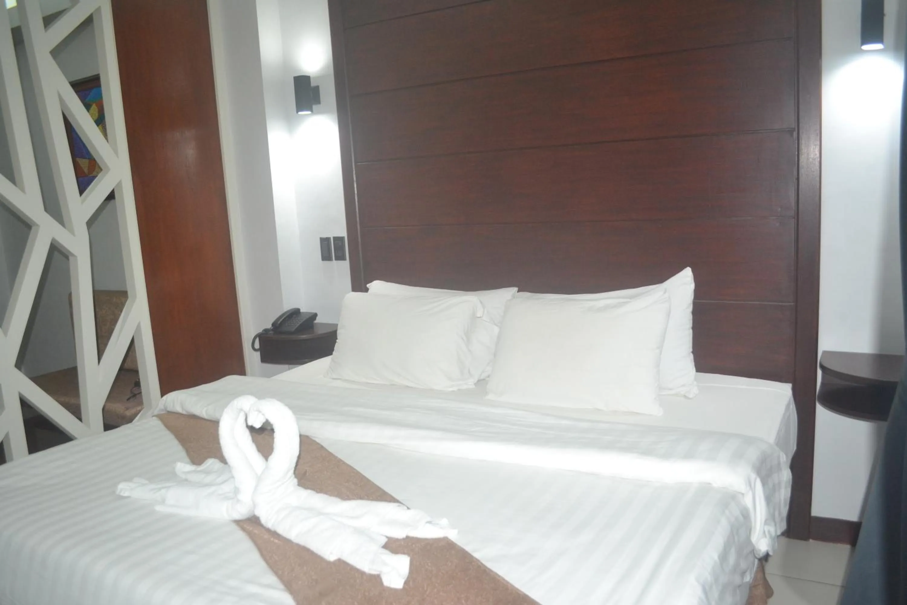 Bed in DM Residente Hotel Inns & Villas