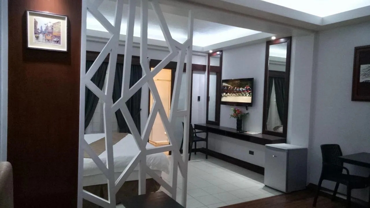 Bedroom in DM Residente Hotel Inns & Villas