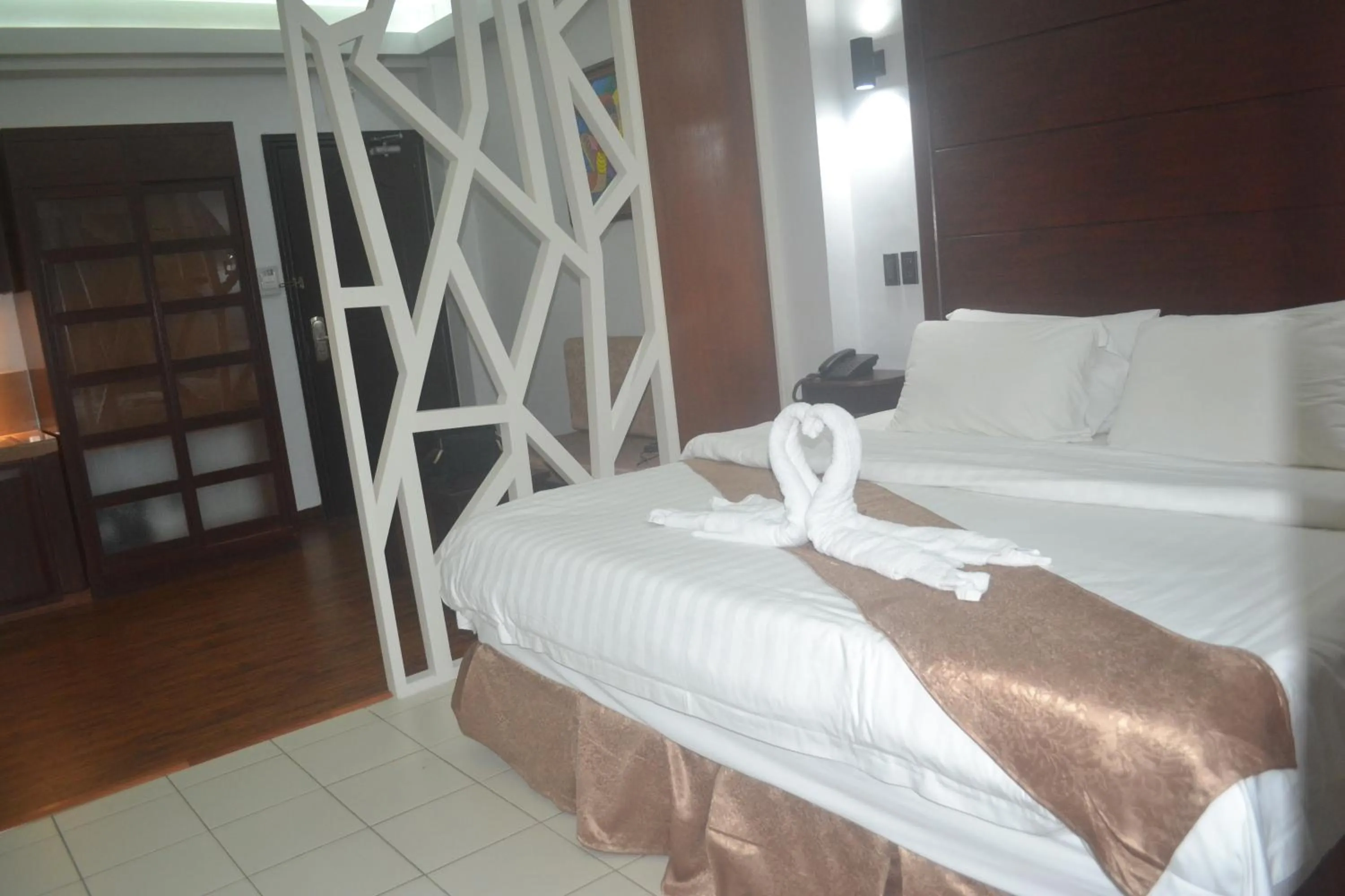 Bed in DM Residente Hotel Inns & Villas