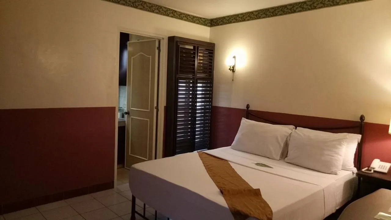 Bedroom, Bed in DM Residente Hotel Inns & Villas