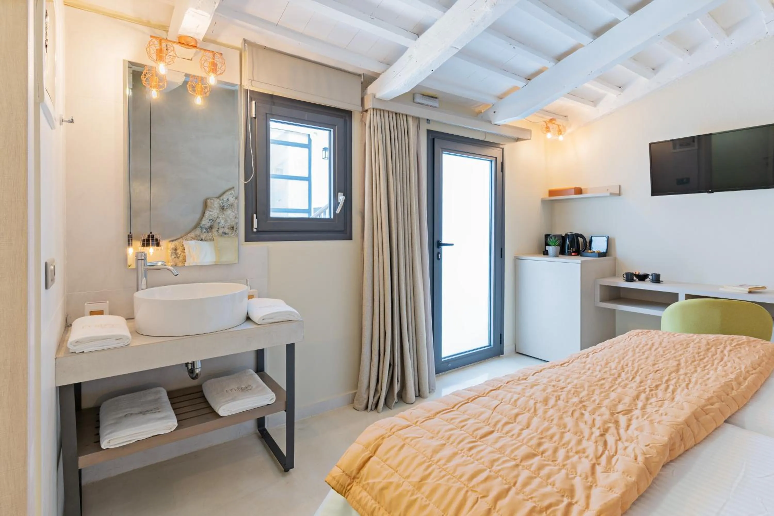 Photo of the whole room, Bed in Mitos-Suites