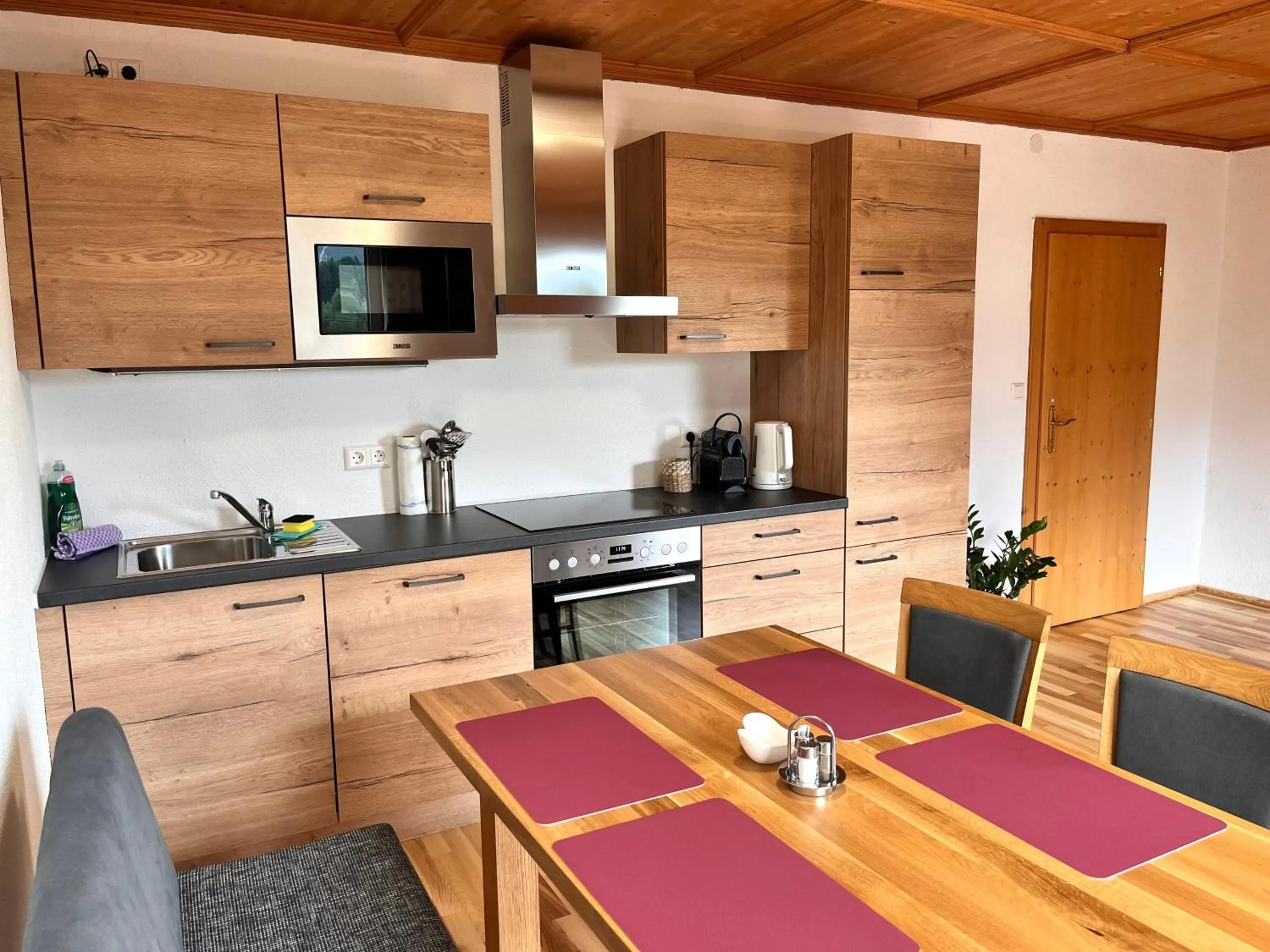 Kitchen or kitchenette in Appartements-Restaurant Schwaiger