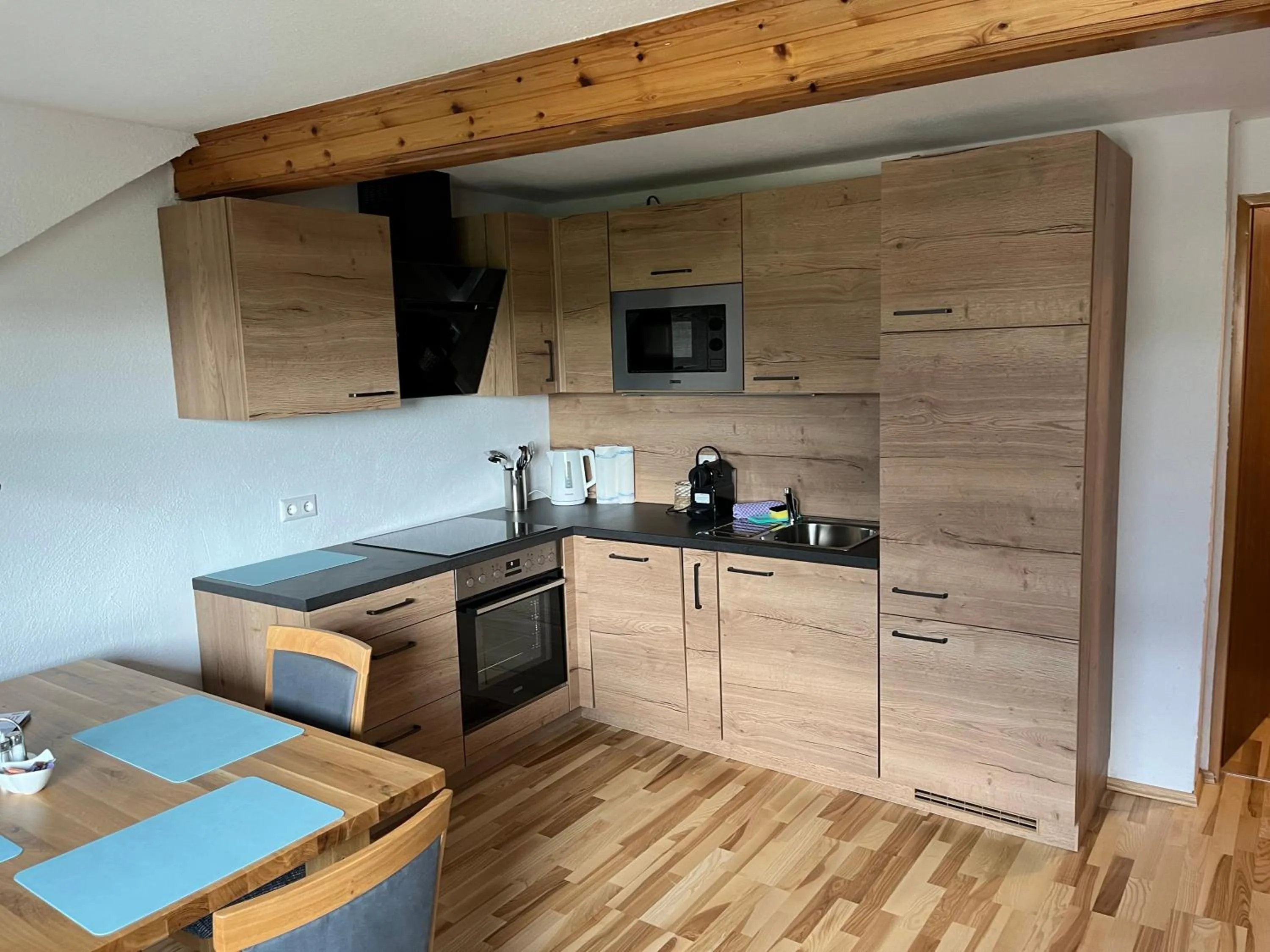 Kitchen or kitchenette in Appartements-Restaurant Schwaiger