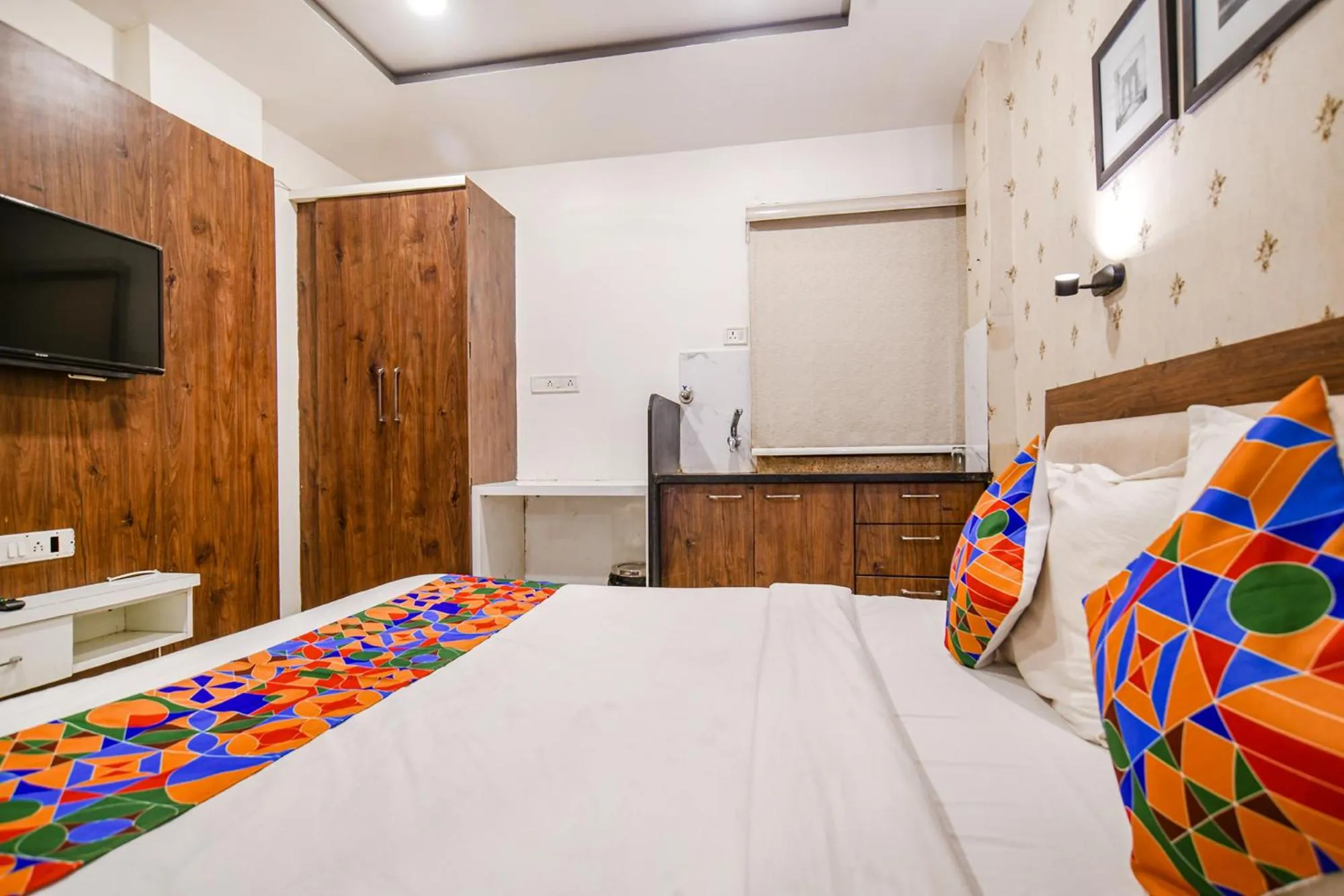 Bed in FabHotel Shree Ram Palace