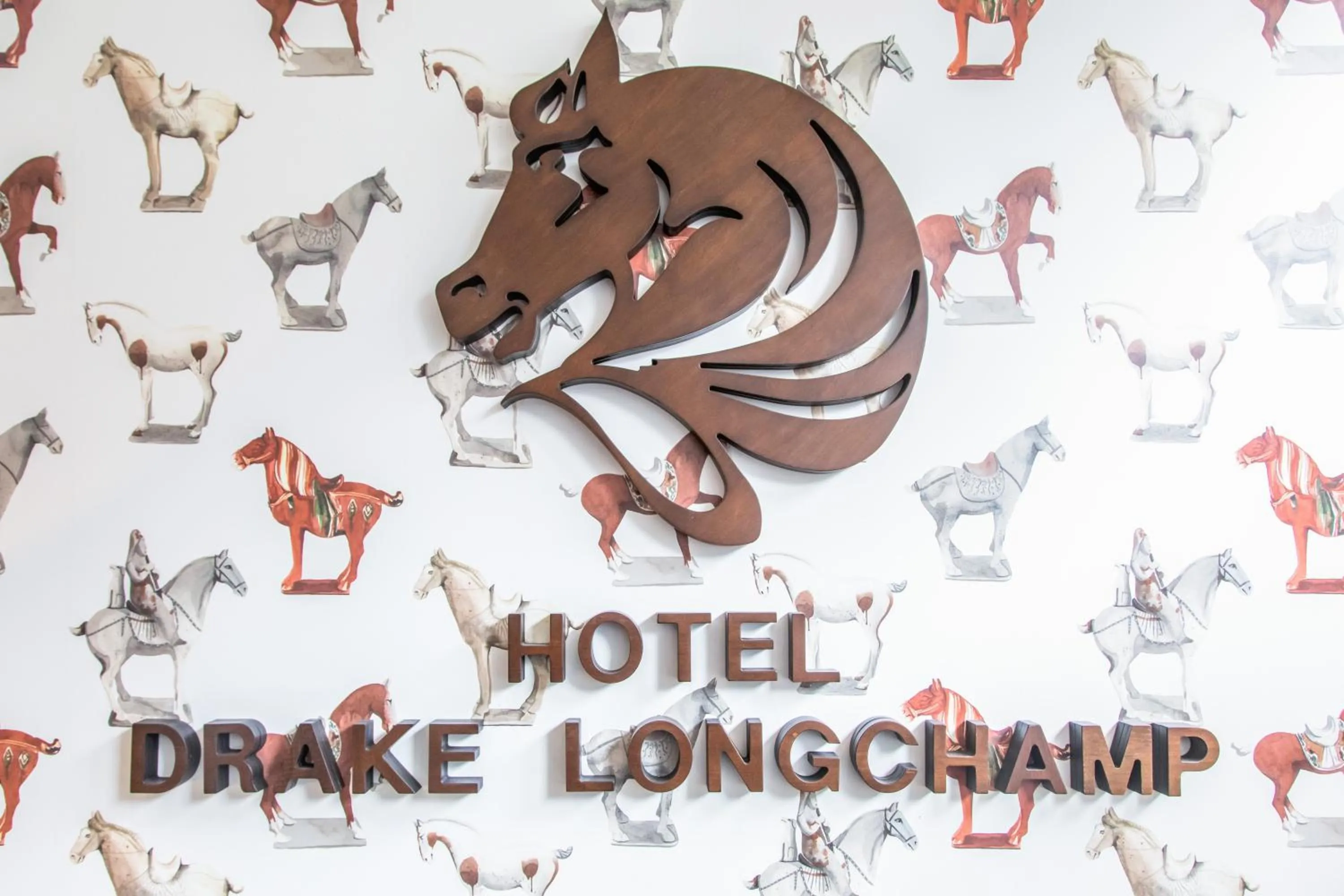 Property logo or sign in Drake Longchamp