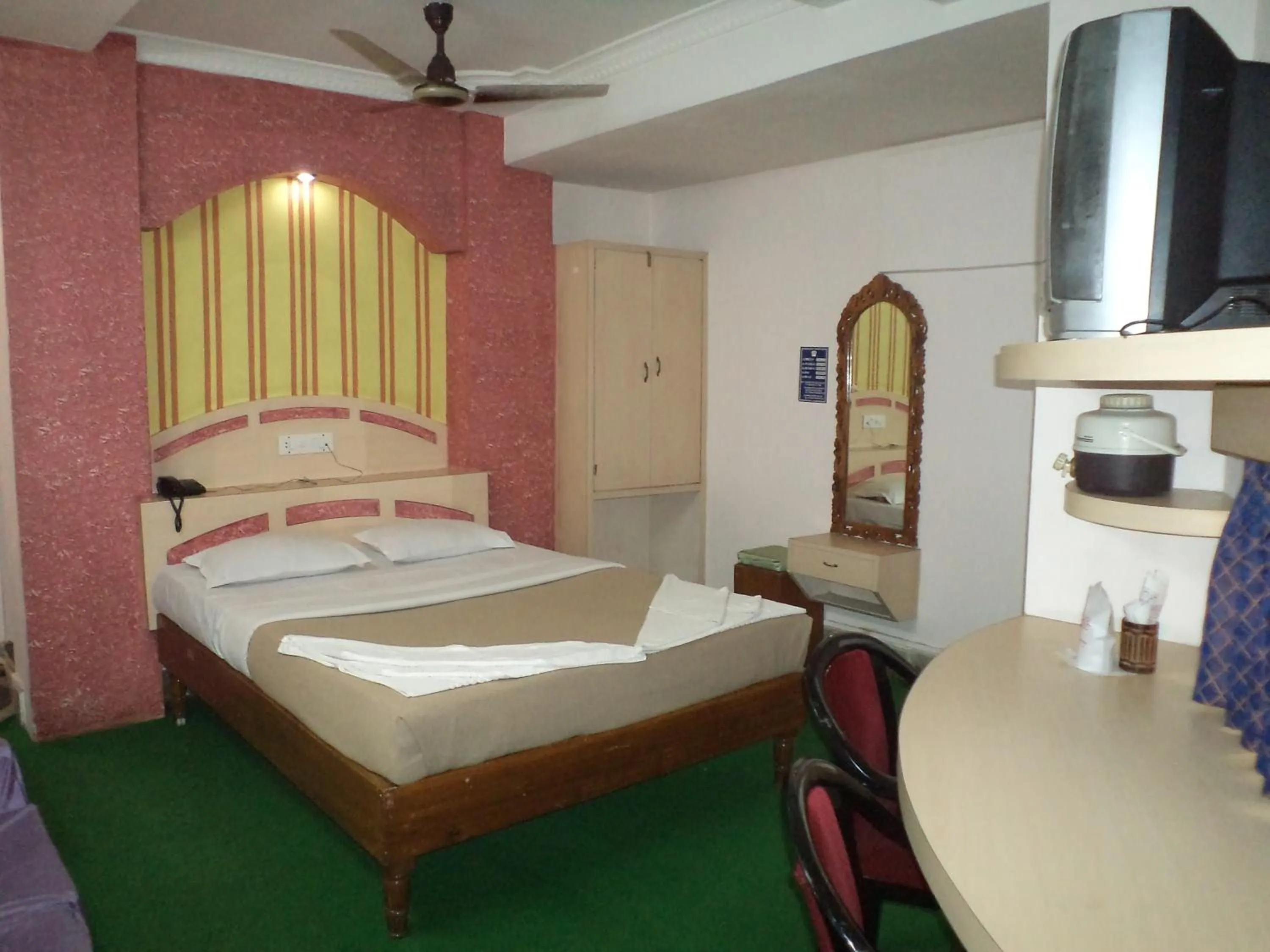 Photo of the whole room, Bed in Hotel Mahalaxmi Indo Myanmar