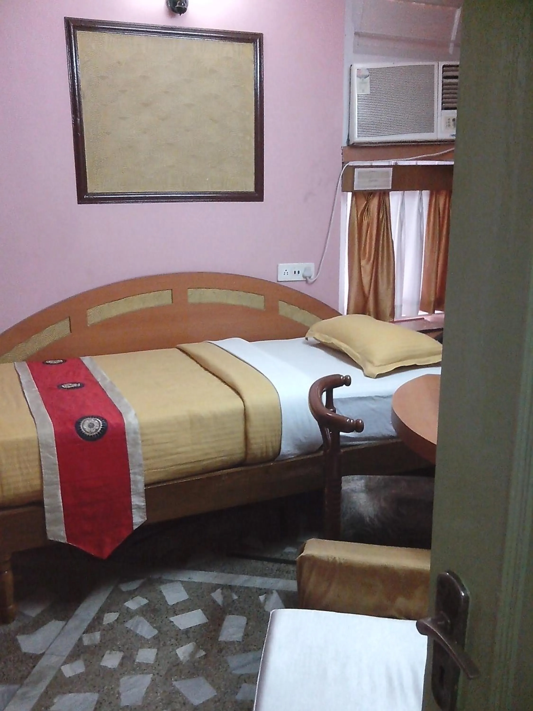 Photo of the whole room, Bed in Hotel Mahalaxmi Indo Myanmar