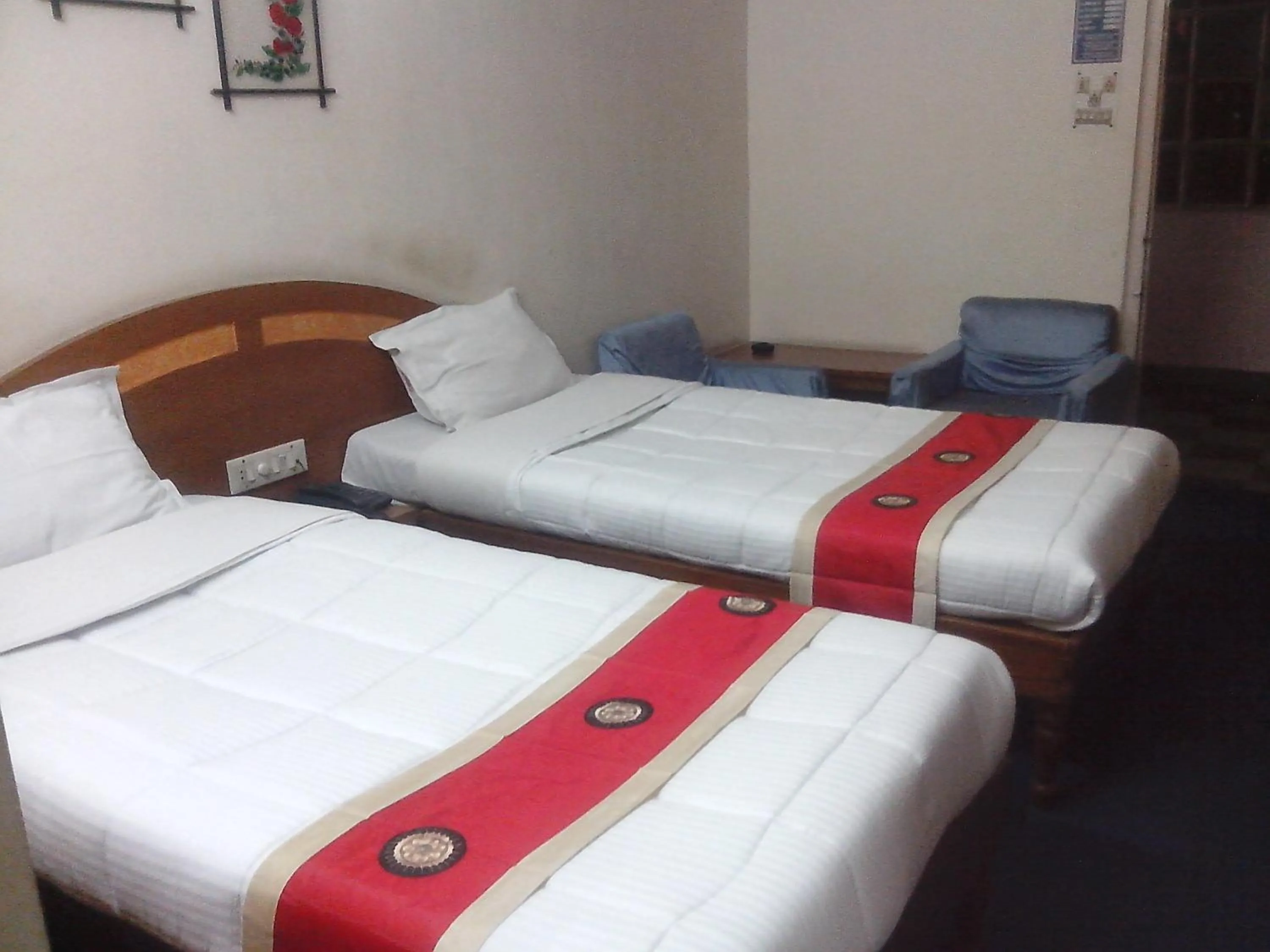 Photo of the whole room, Bed in Hotel Mahalaxmi Indo Myanmar