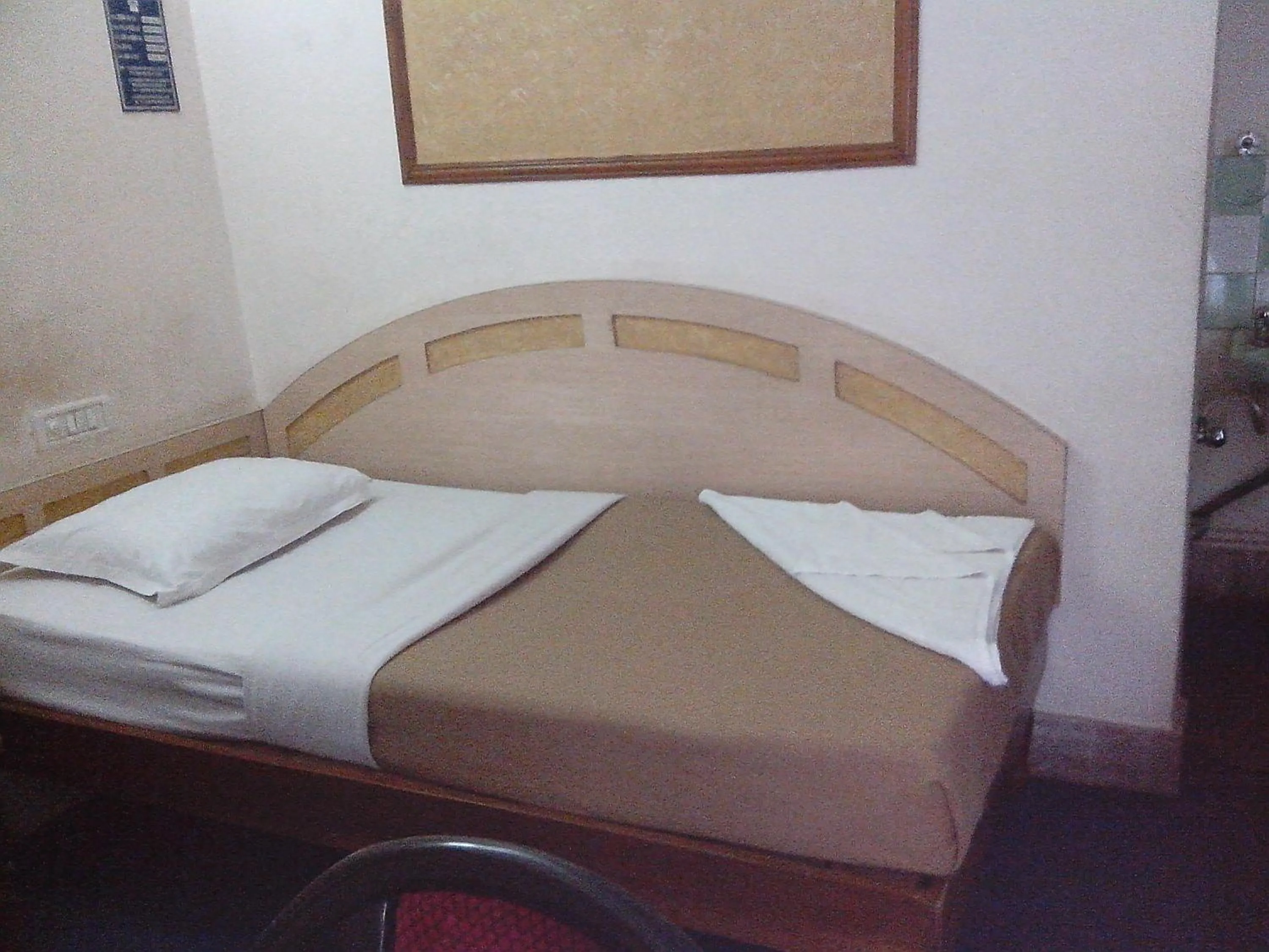 Photo of the whole room, Bed in Hotel Mahalaxmi Indo Myanmar