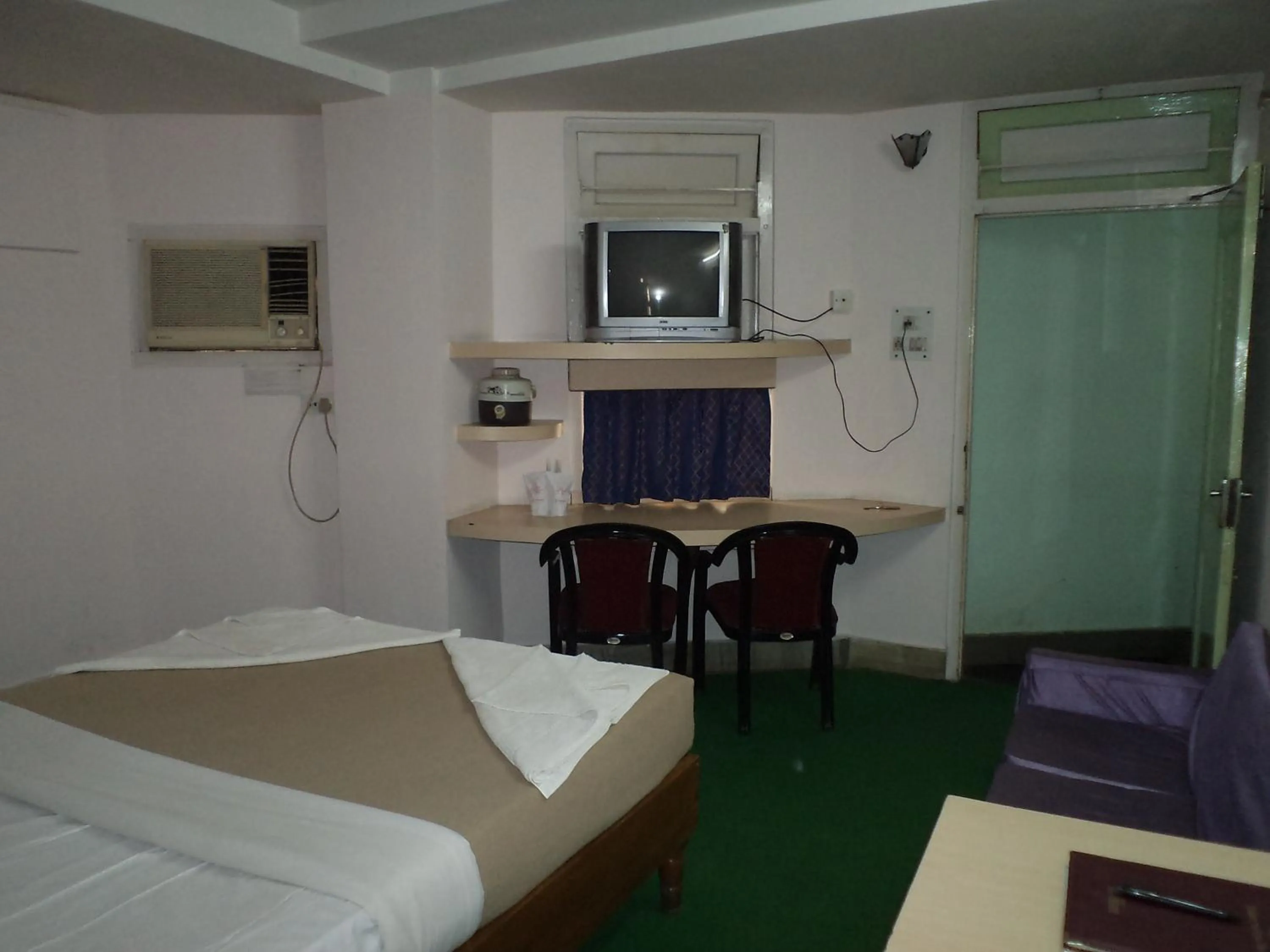 Photo of the whole room, Bed in Hotel Mahalaxmi Indo Myanmar