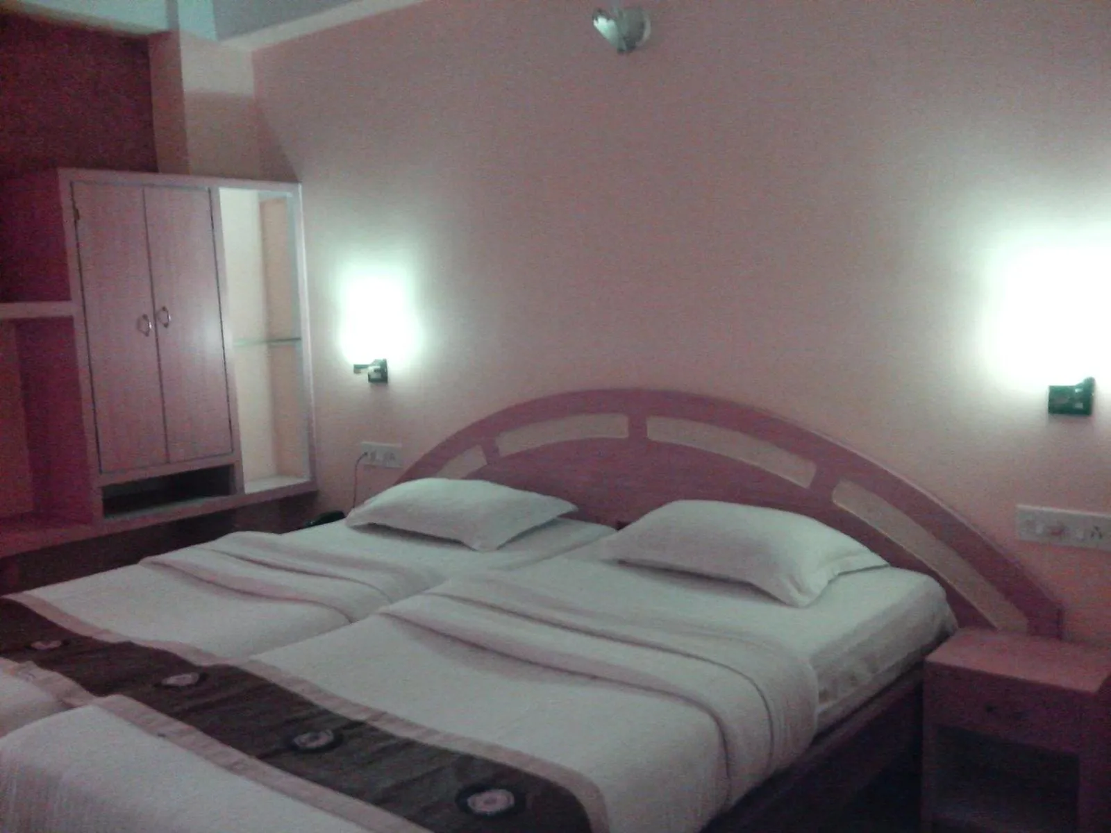 Photo of the whole room, Bed in Hotel Mahalaxmi Indo Myanmar
