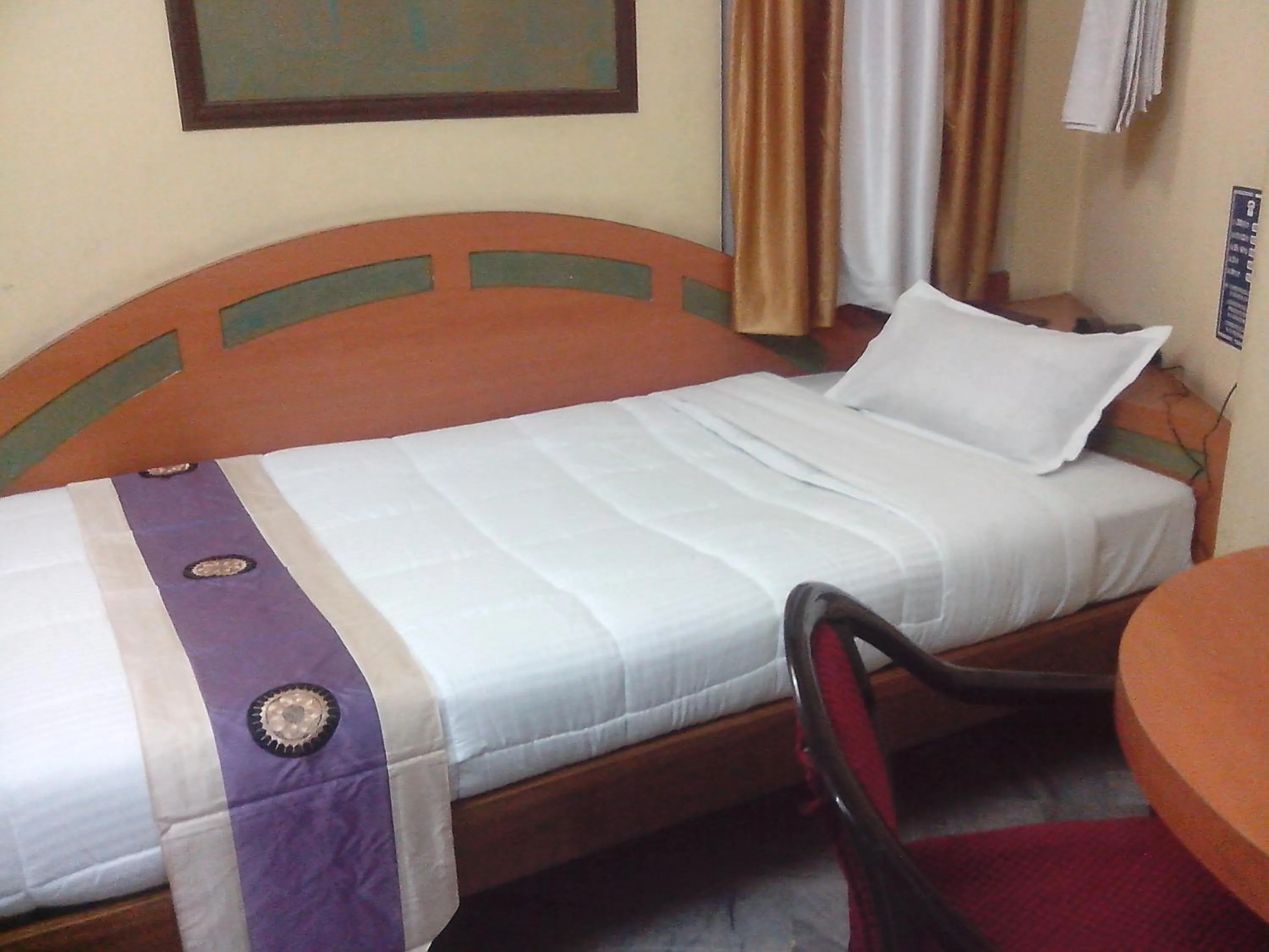Photo of the whole room, Bed in Hotel Mahalaxmi Indo Myanmar