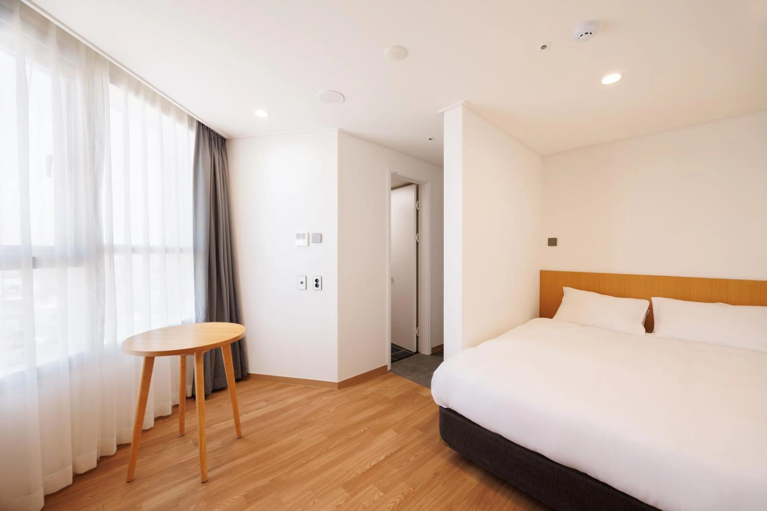 Bed in Kenny Stay Jeju Mosulpo