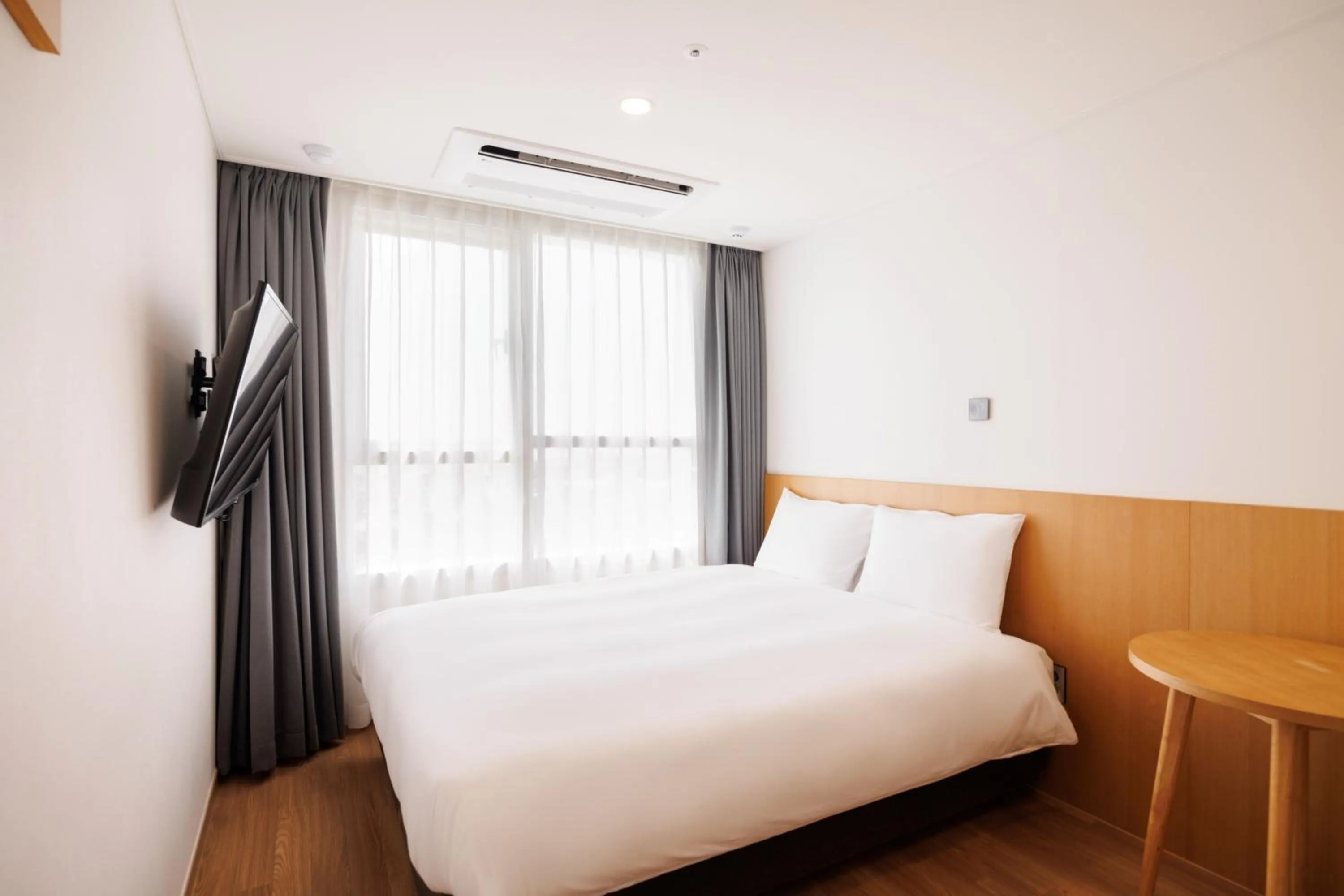 Bed in Kenny Stay Jeju Mosulpo