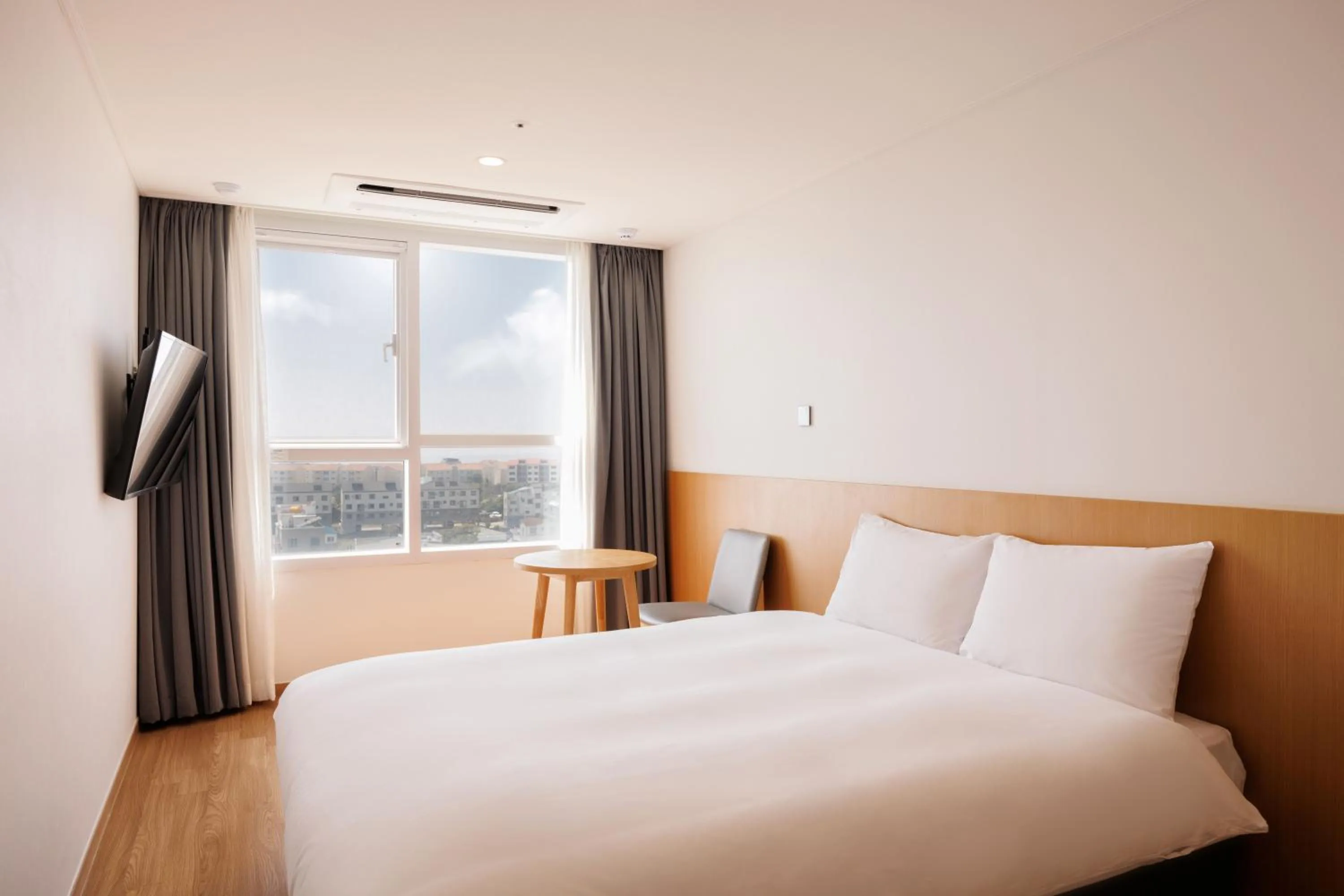 Bed in Kenny Stay Jeju Mosulpo